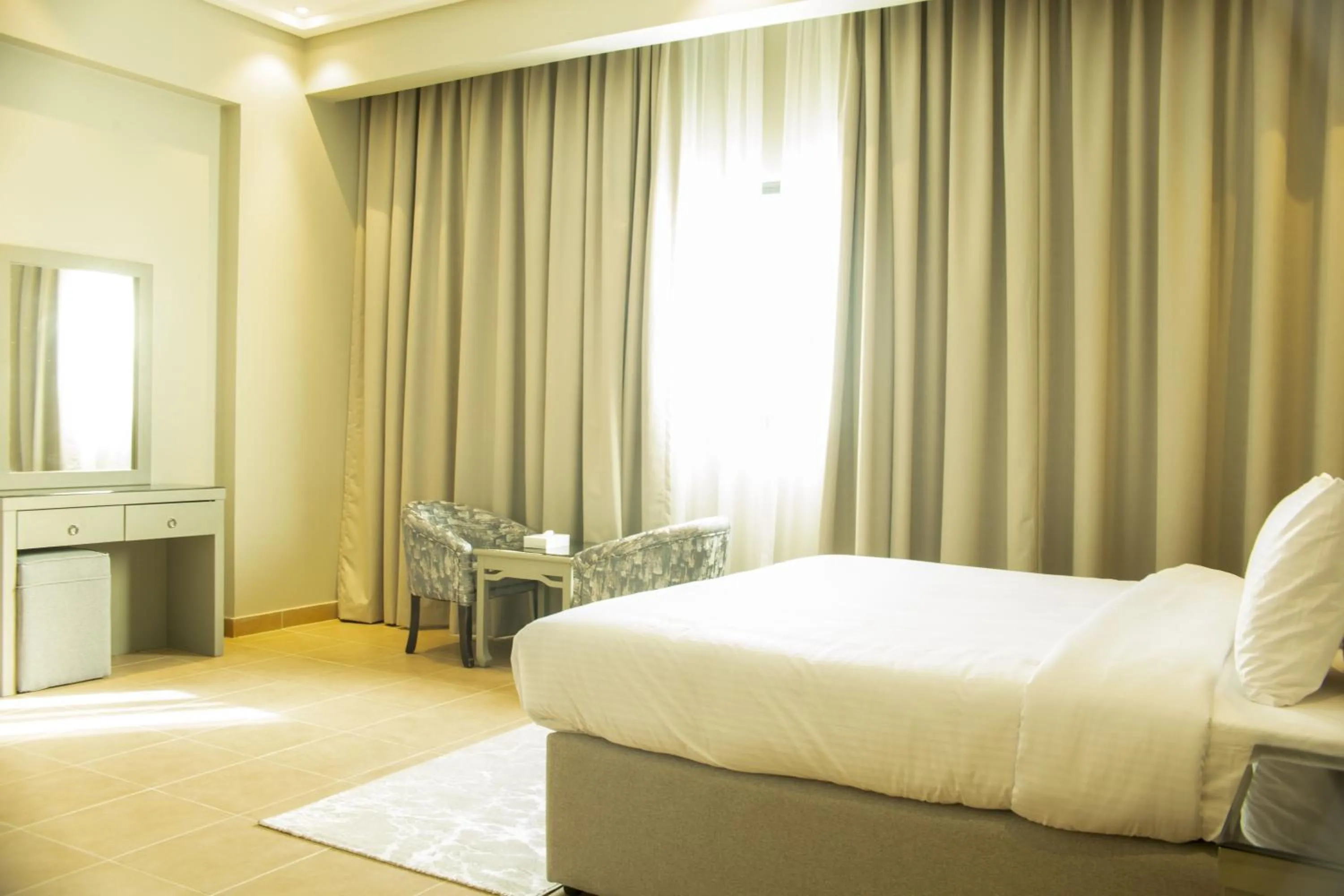 Photo of the whole room, Bed in Infinity Tower Suites WLL