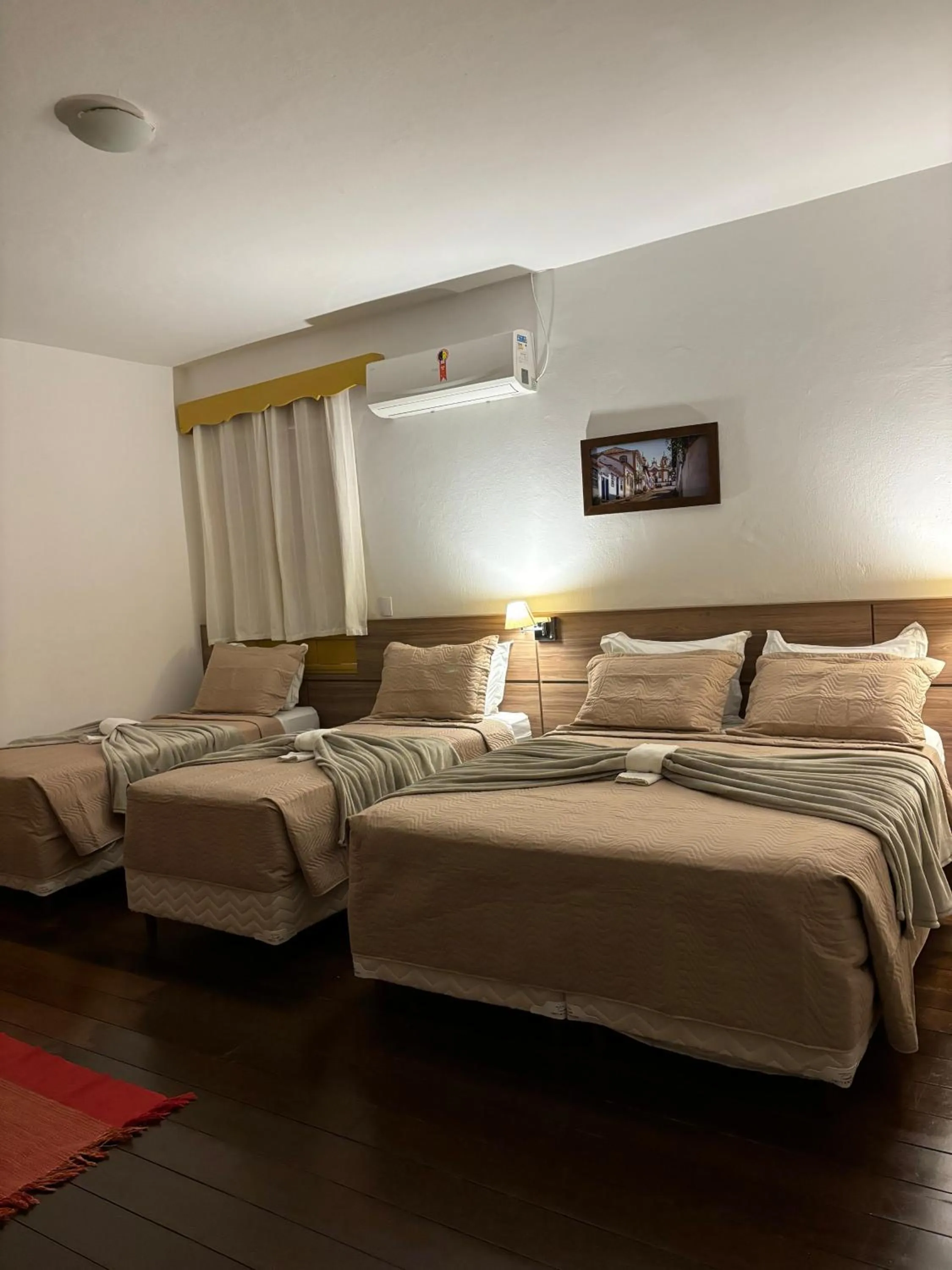 Bed in Pousada o Amanhecer