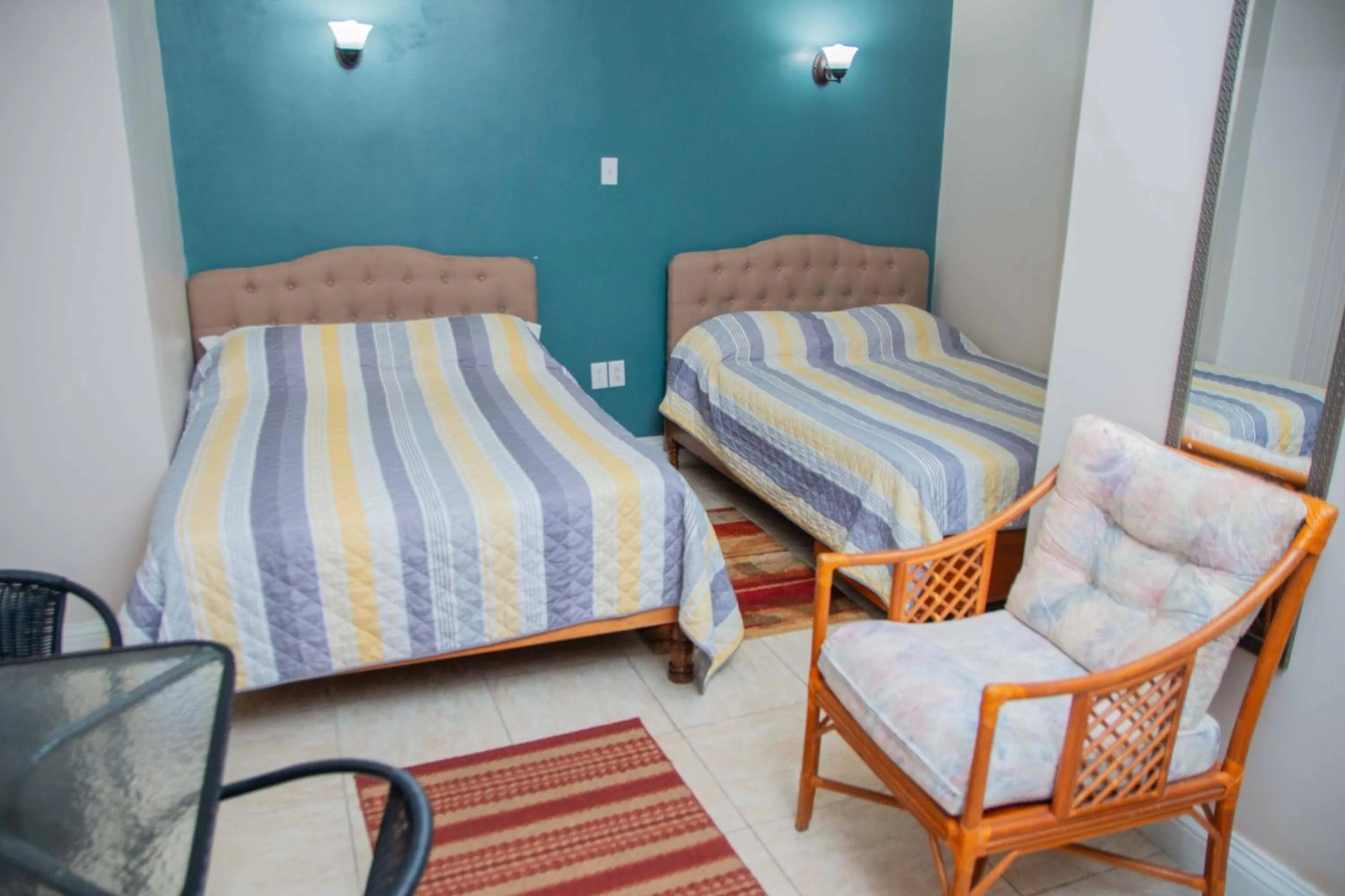 Bed in Windjammer International Cuisine & Comfort Inn
