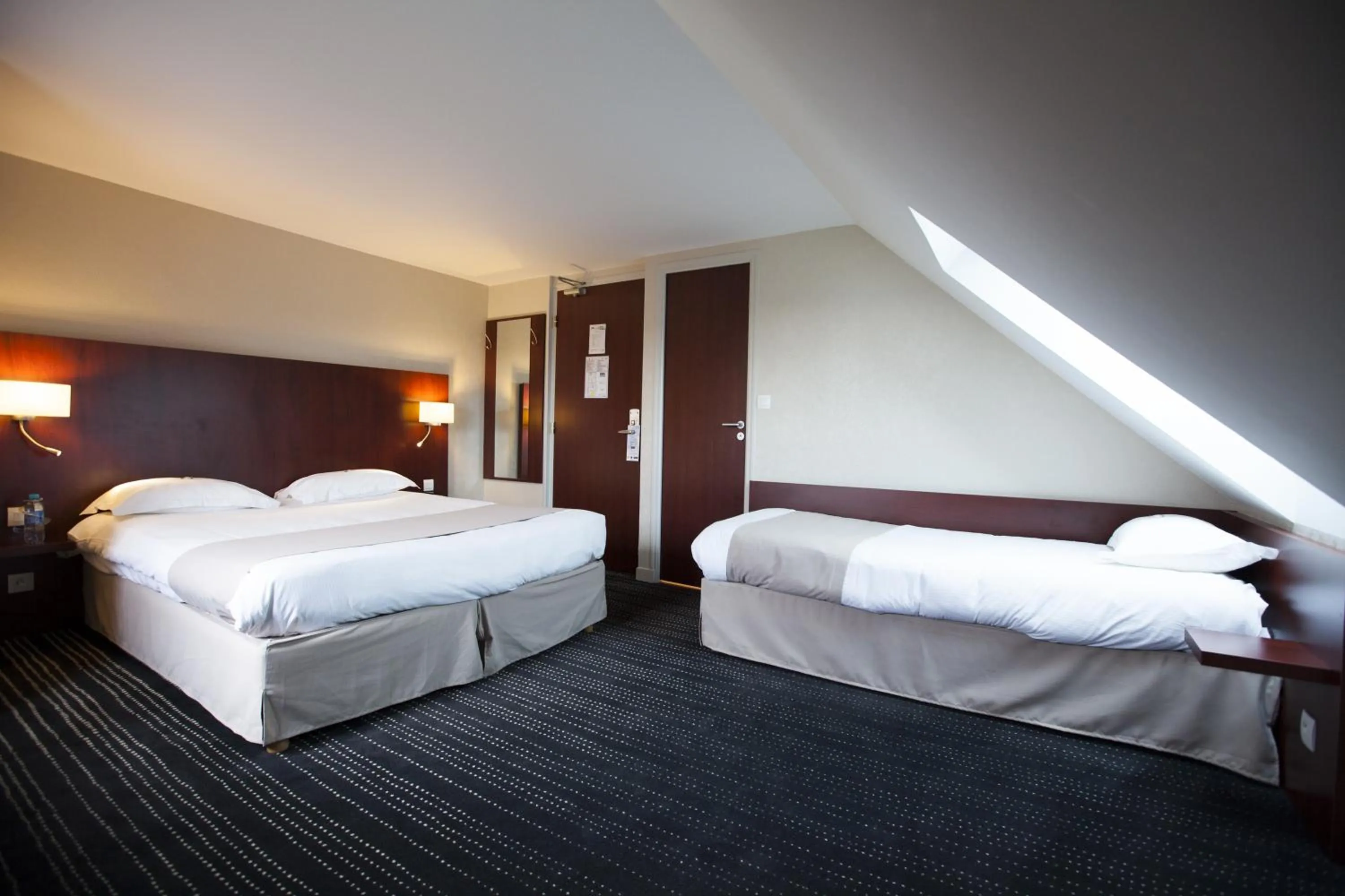 Bed in Kyriad Saint-Malo Dinard