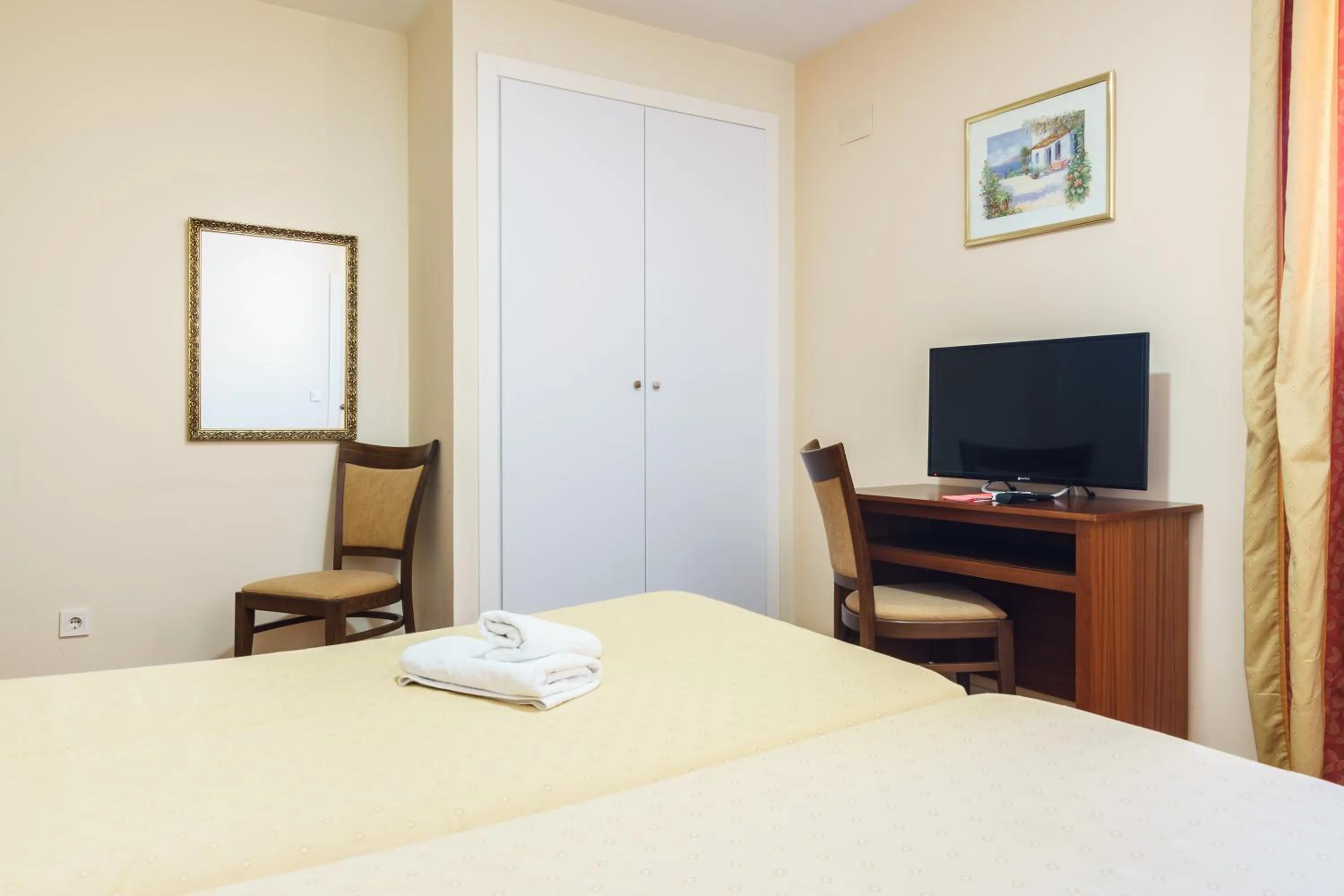 Bed in Hotel Carlos V Jerez by Vivere Stays
