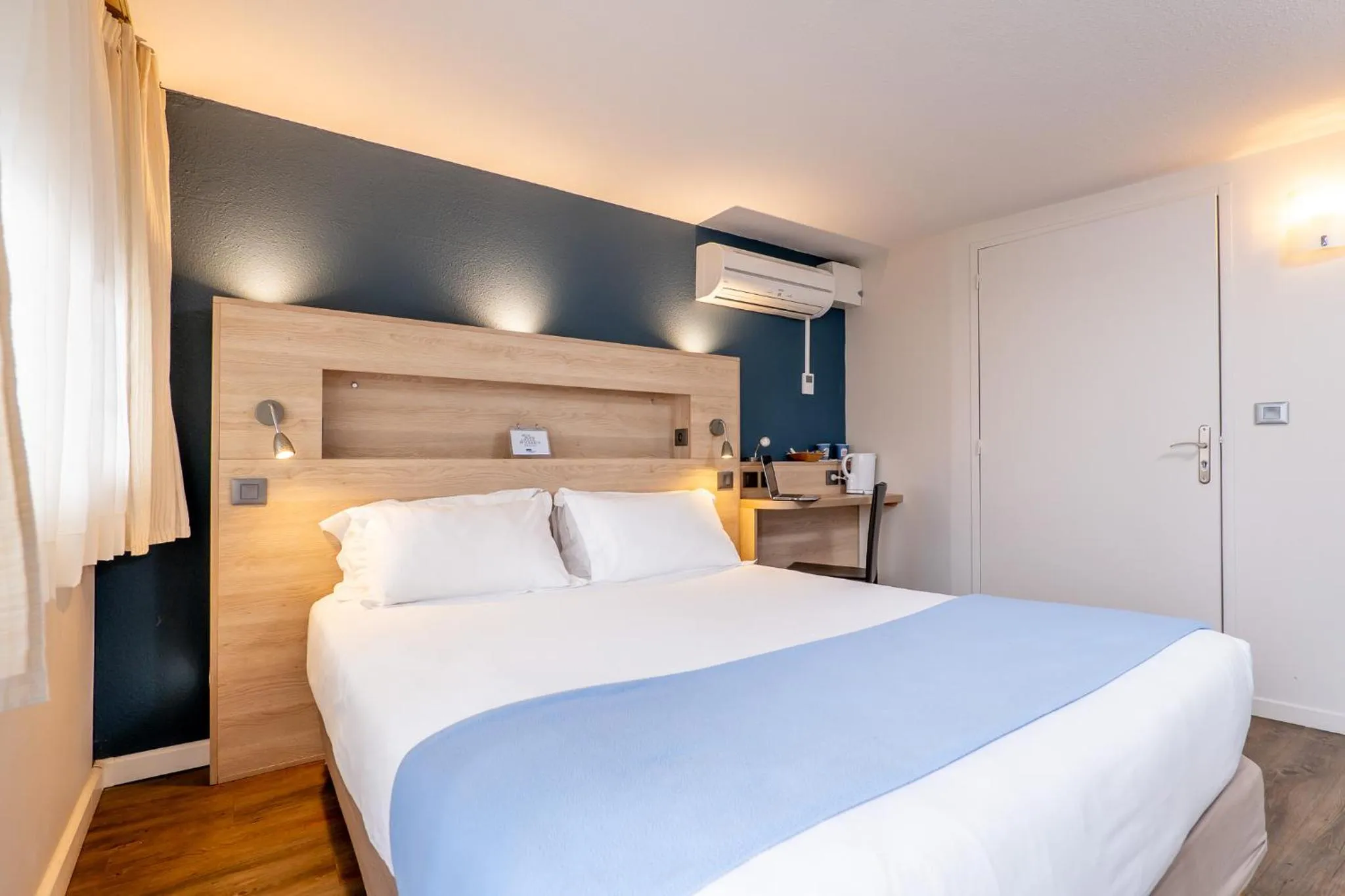 Bed in Kyriad Digne-Les-Bains