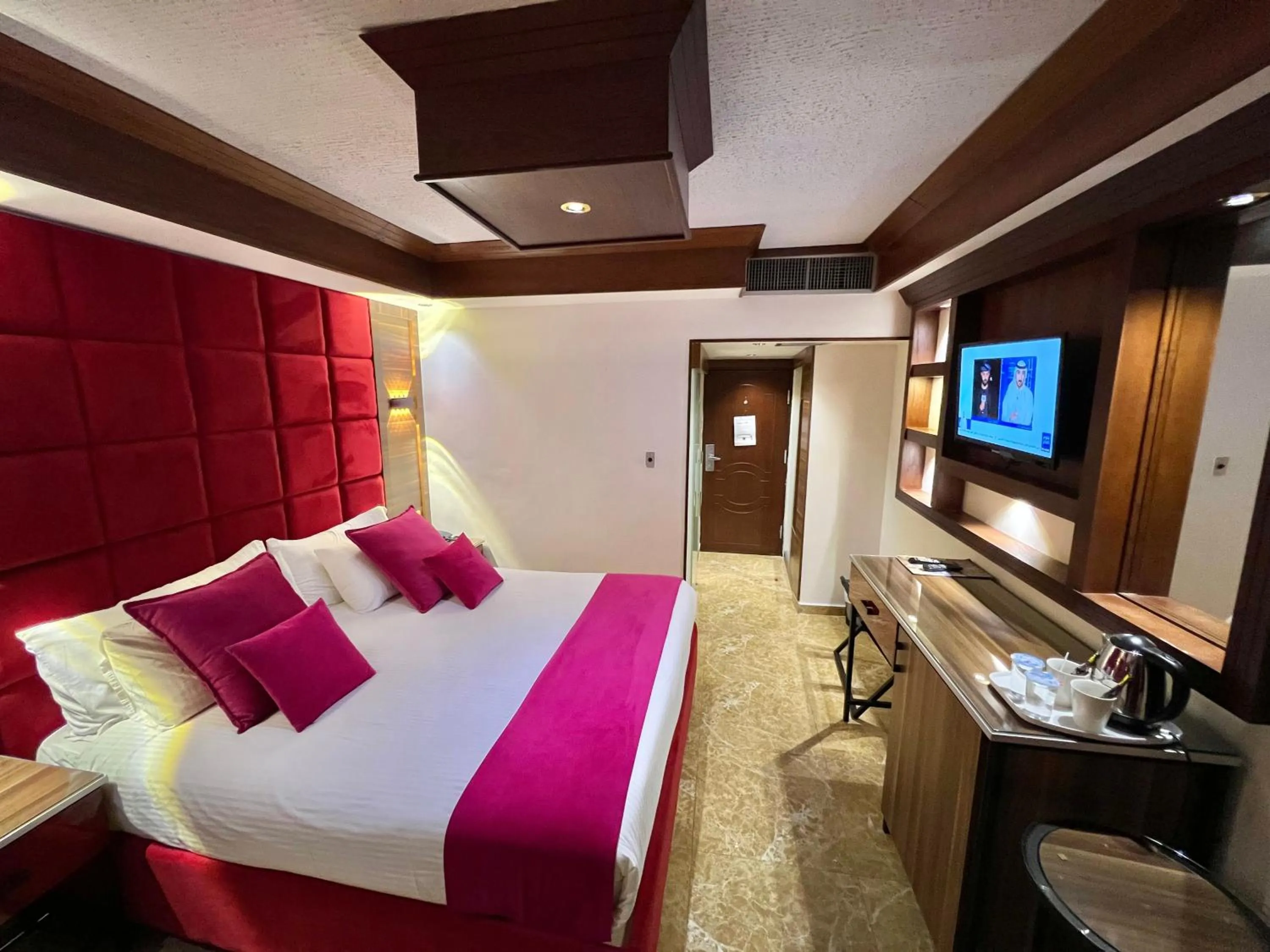 Communal lounge/ TV room, Bed in Petra Sella Hotel