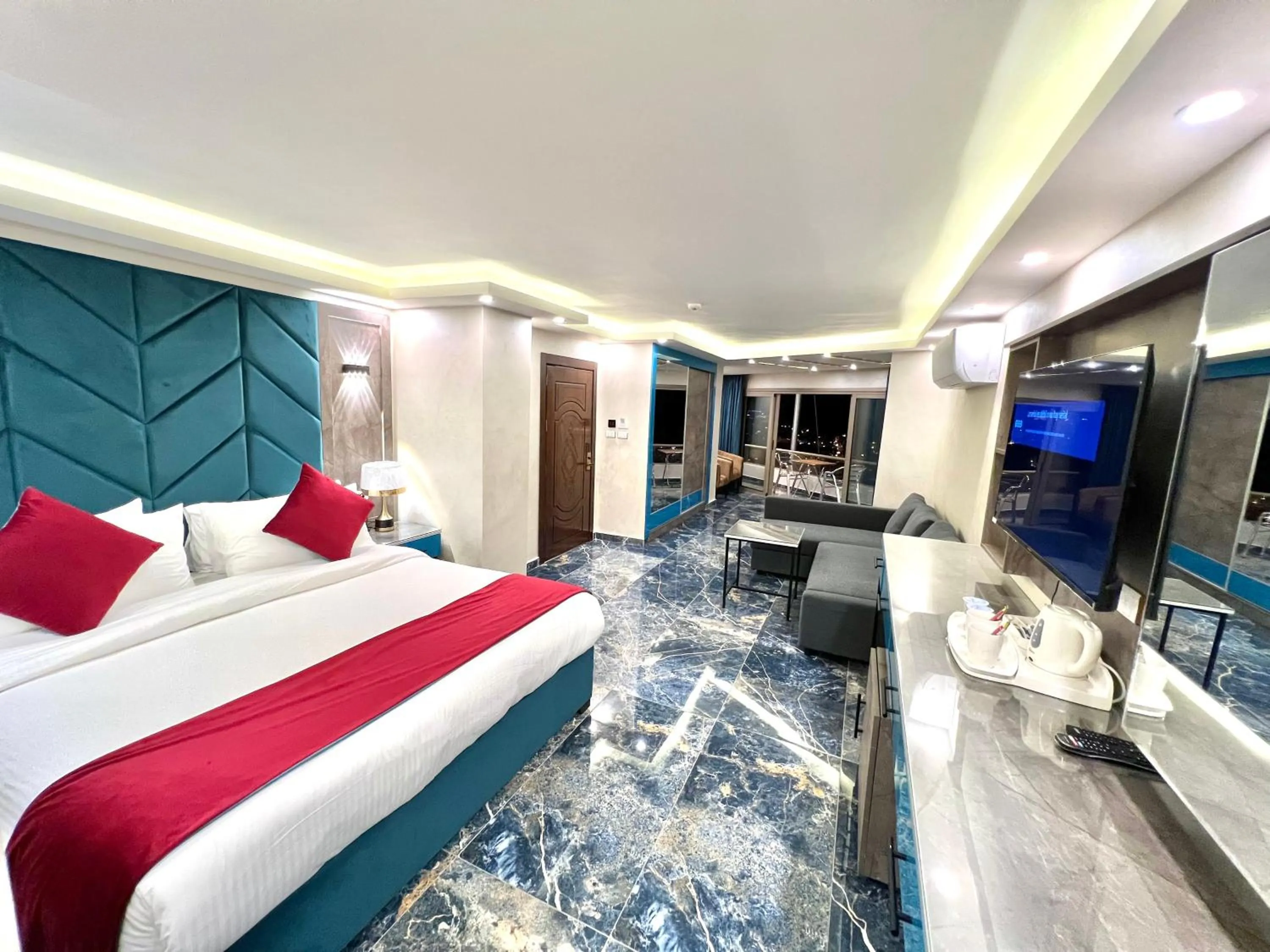 Communal lounge/ TV room, Bed in Petra Sella Hotel