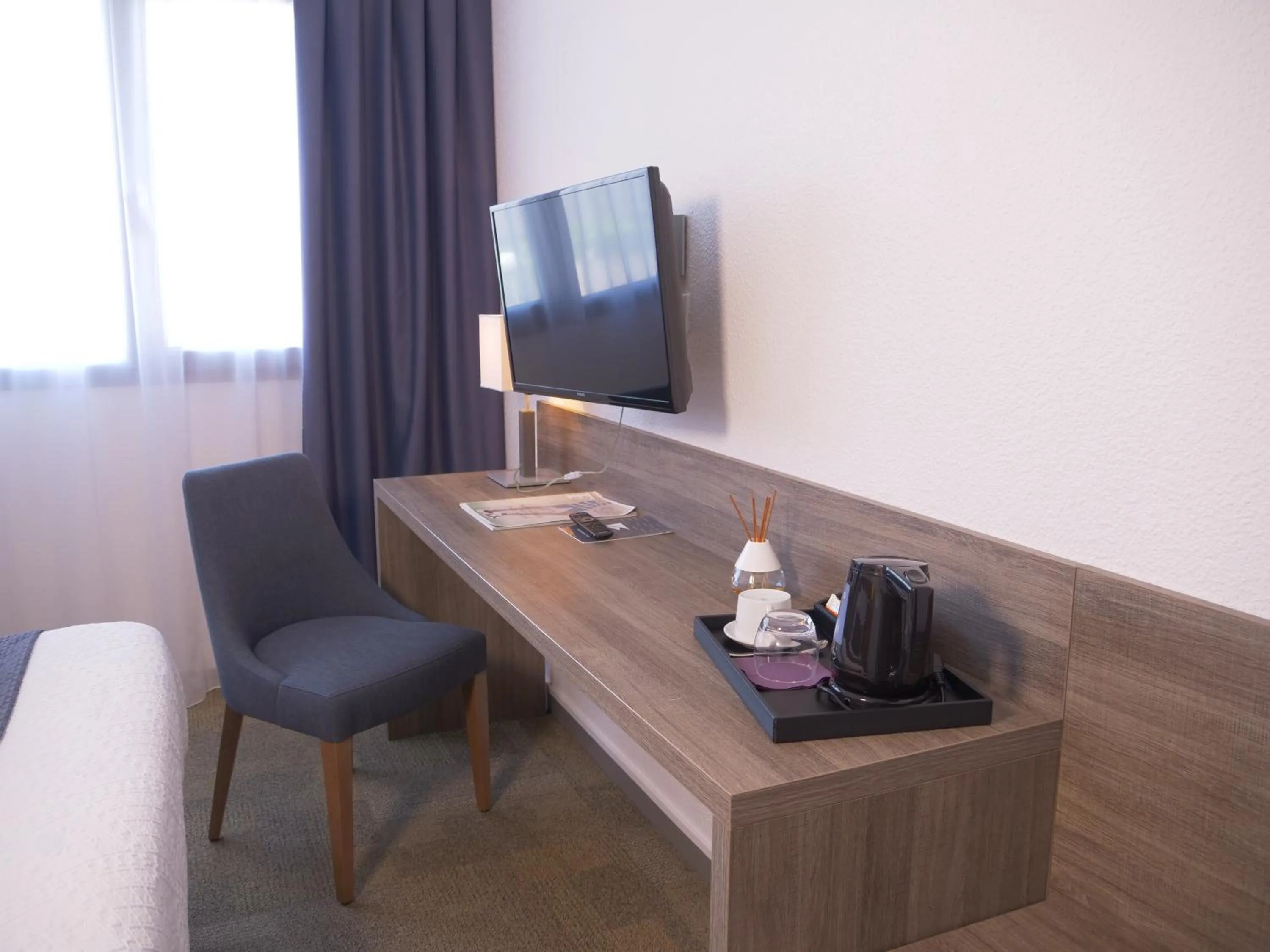 Seating area in KYRIAD LYON EST - Genas Eurexpo