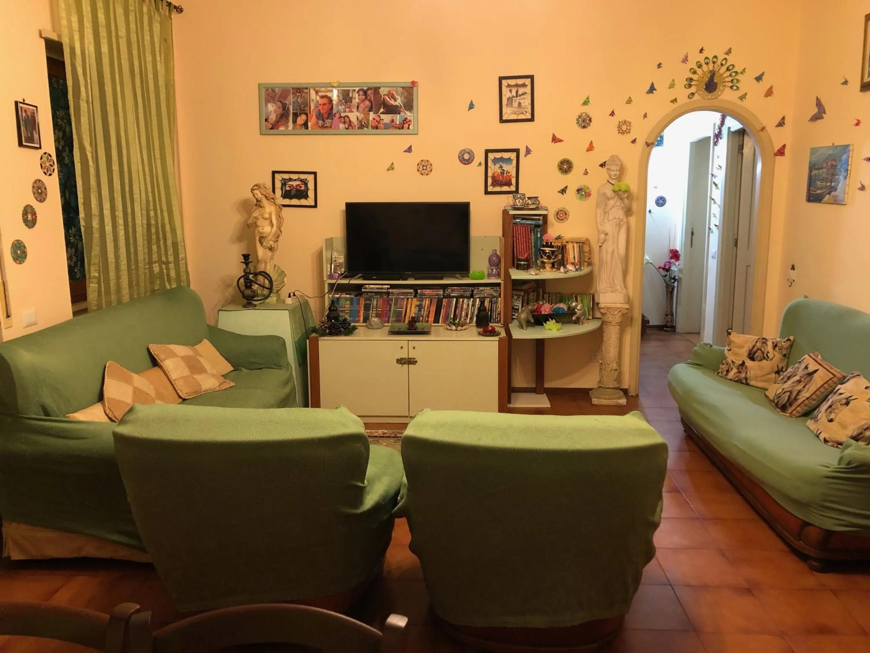 Communal lounge/ TV room in B&B Le Mille E Una Notte