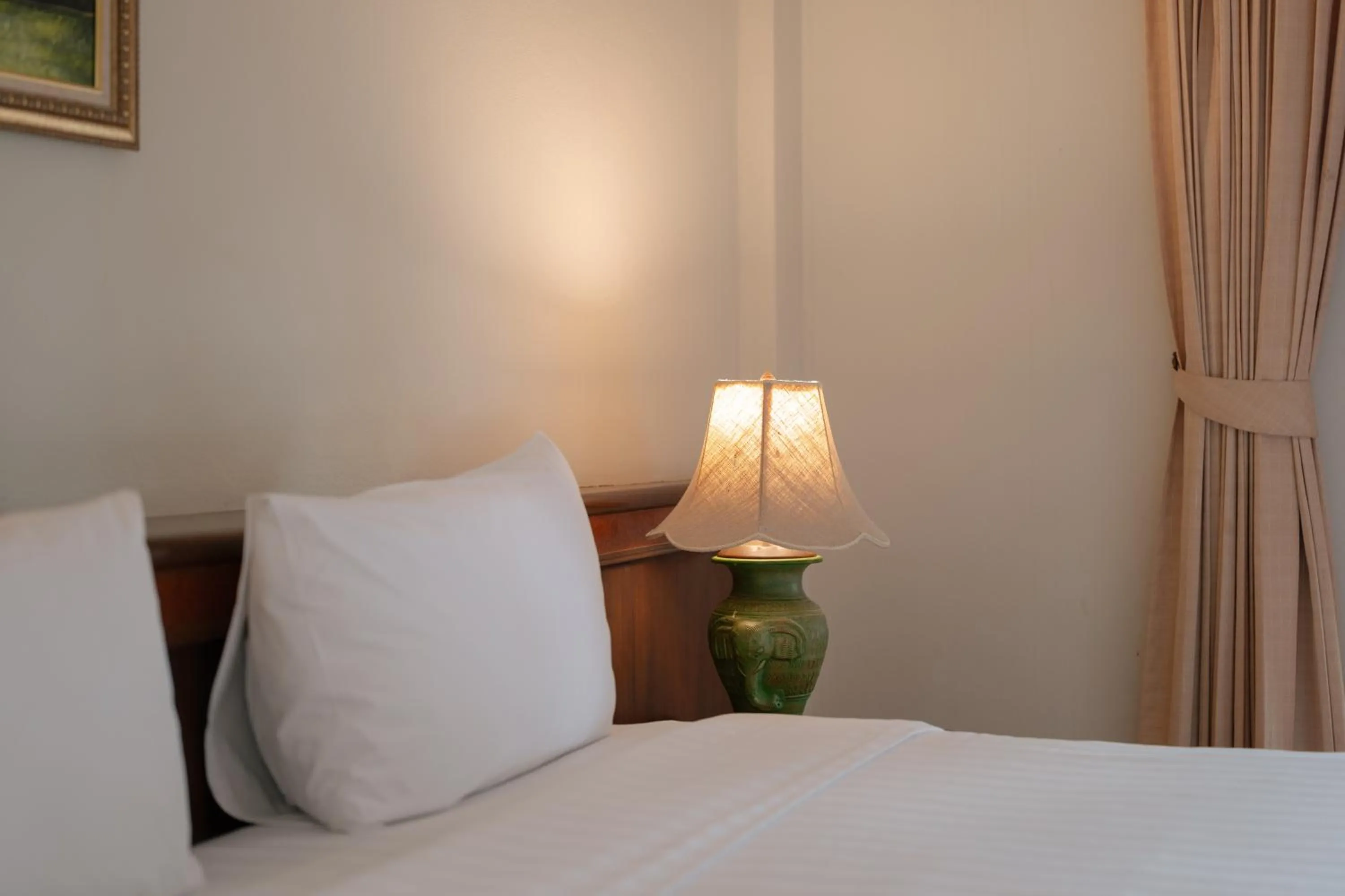 Text overlay, Bed in Erawan Phangnga Hotel, Natai Beach