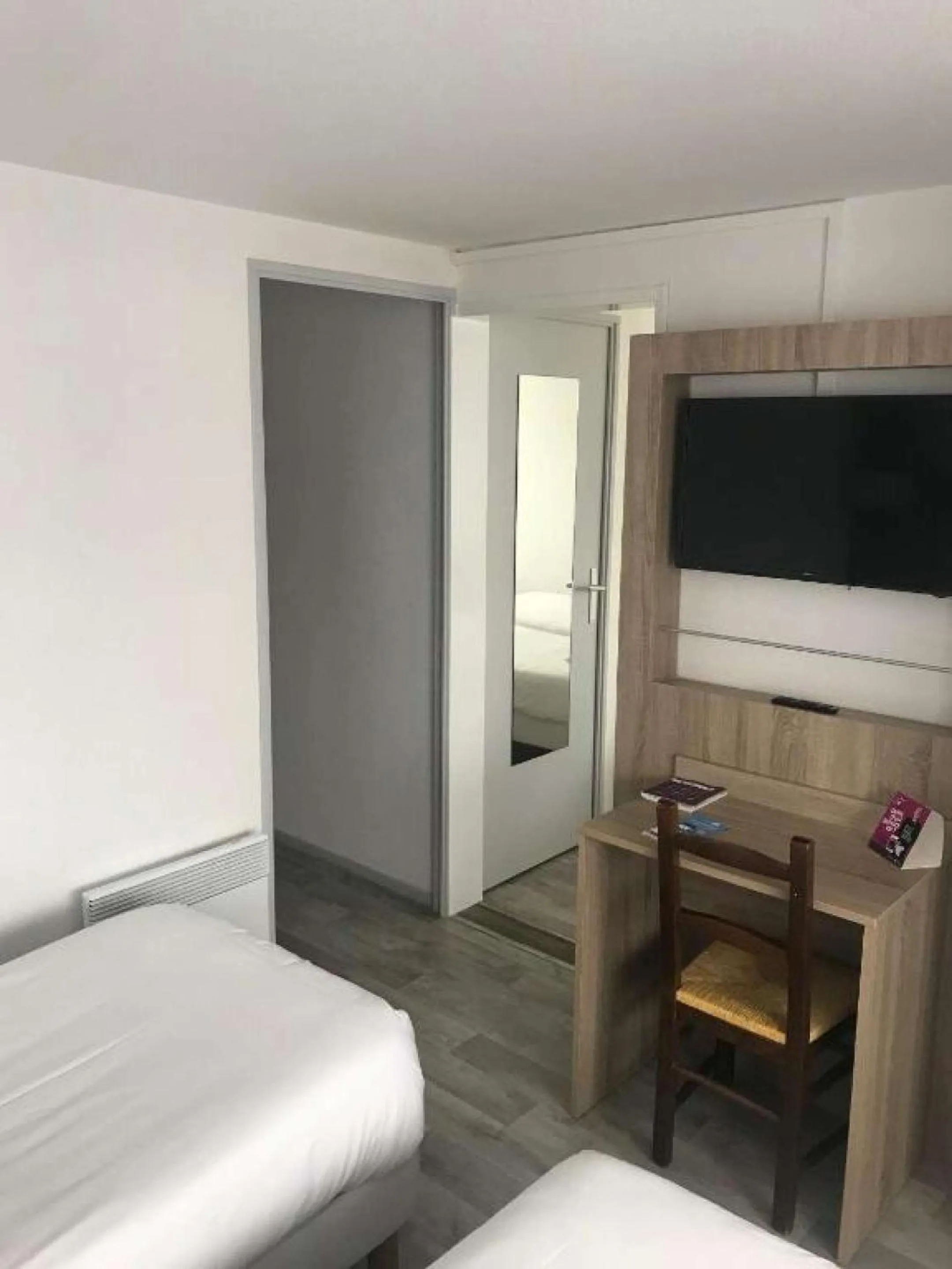 Bedroom, Bed in BRIT HOTEL Confort MORLAIX