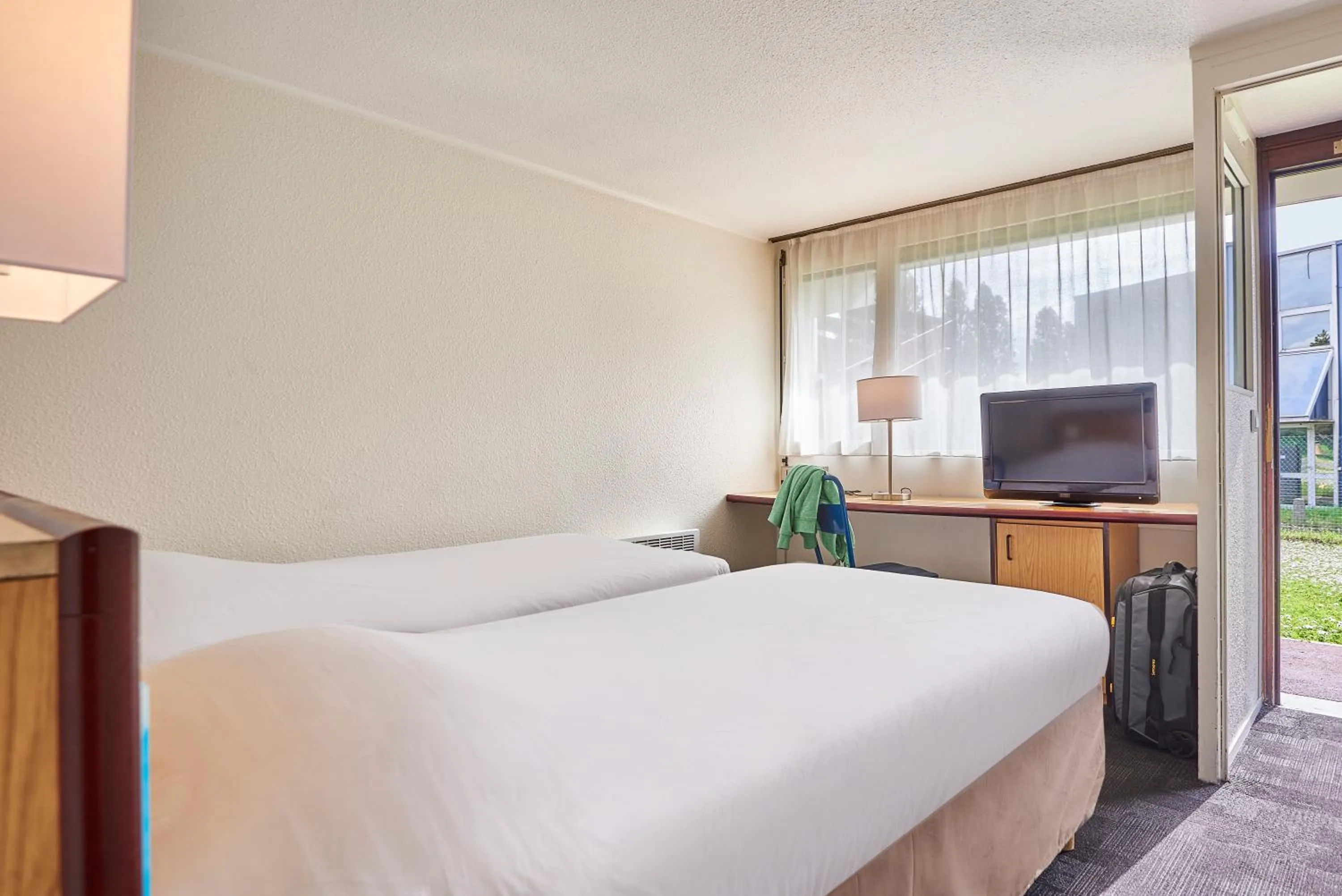 Bed in Kyriad Direct Le Bourget Gonesse