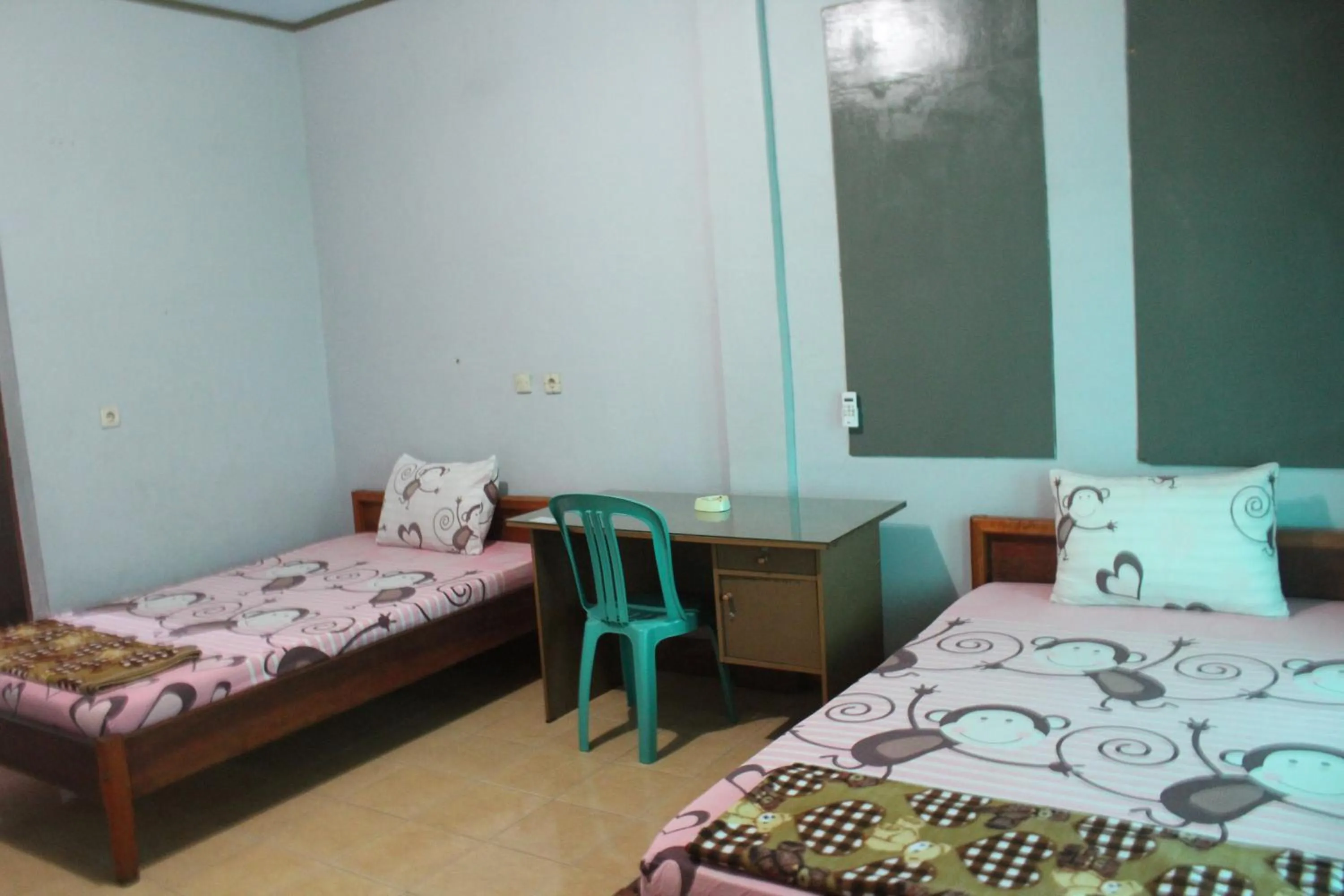 Photo of the whole room, Bed in Penginapan Artha