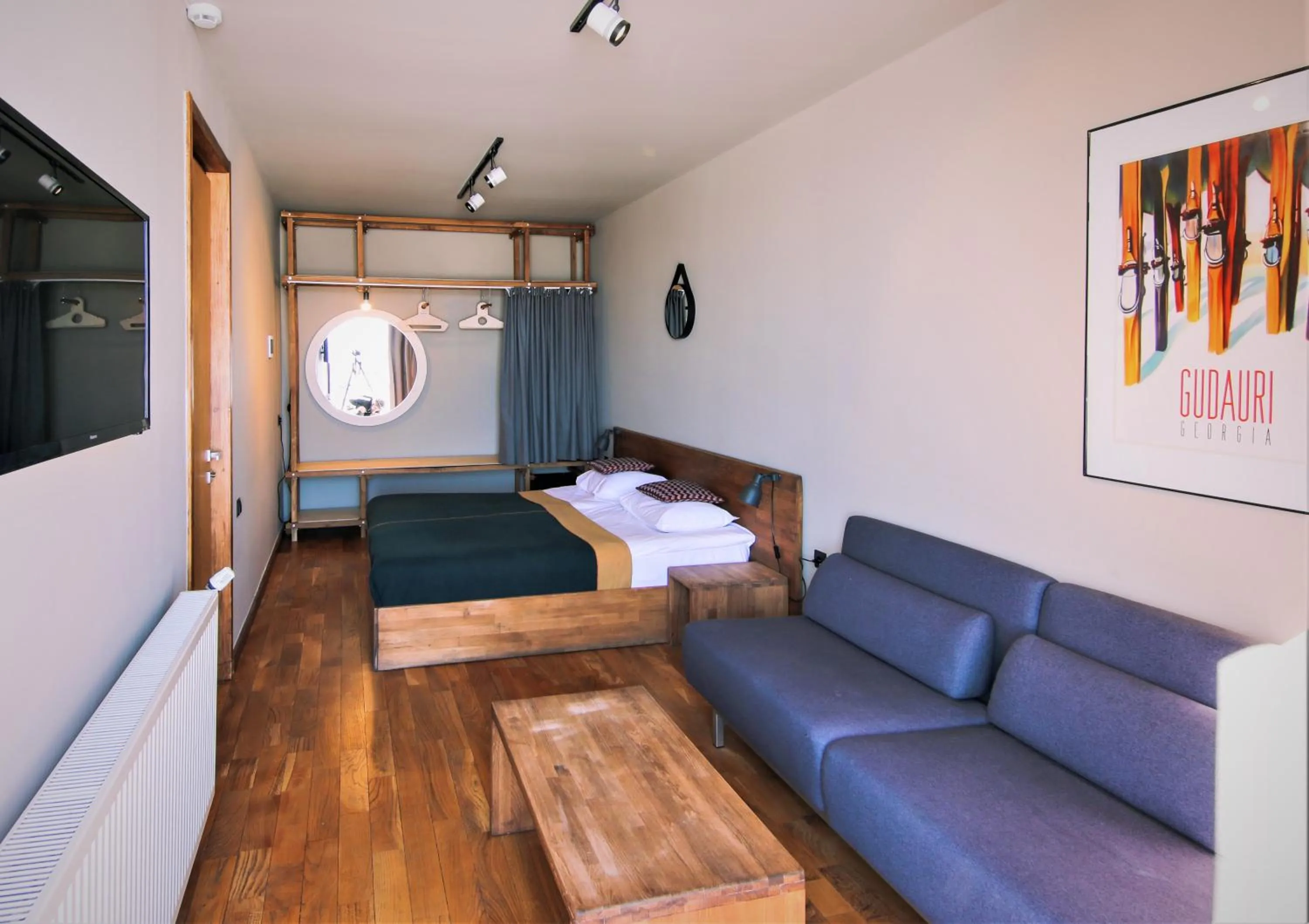 Living room, Bed in Quadrum Hotel