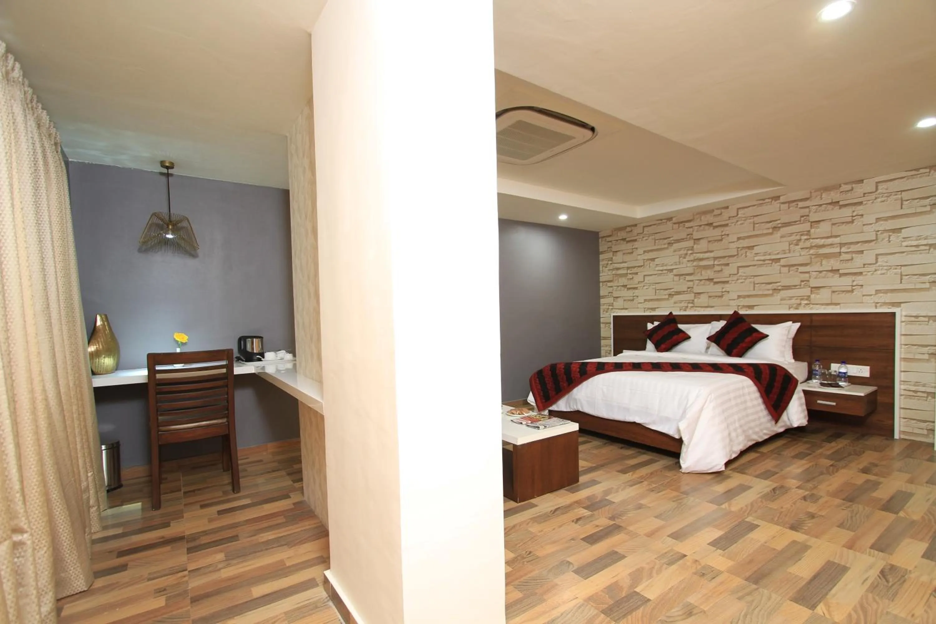 Bed in Icon Business Hotel by Bhagini