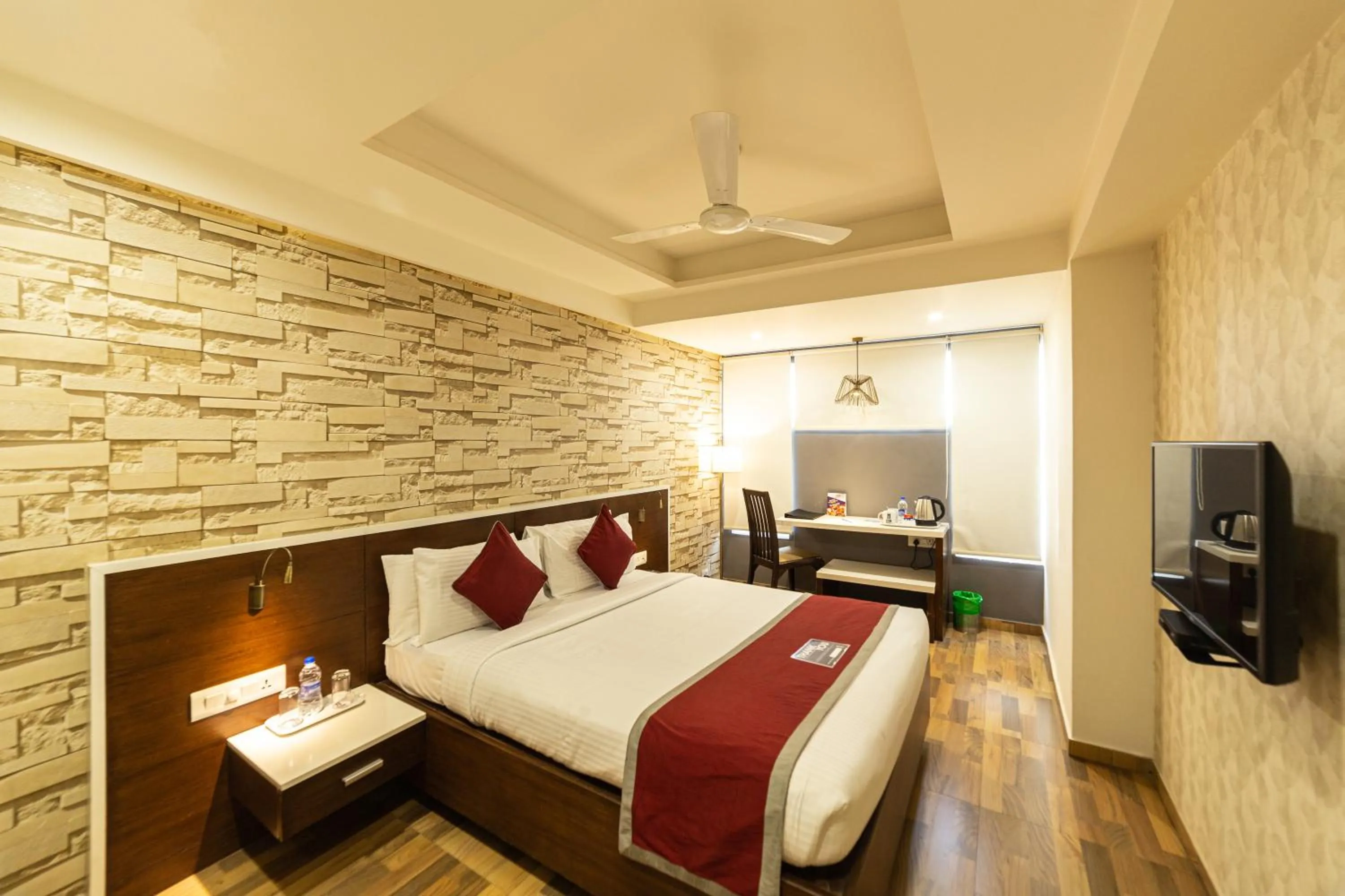 Bed in Icon Business Hotel by Bhagini