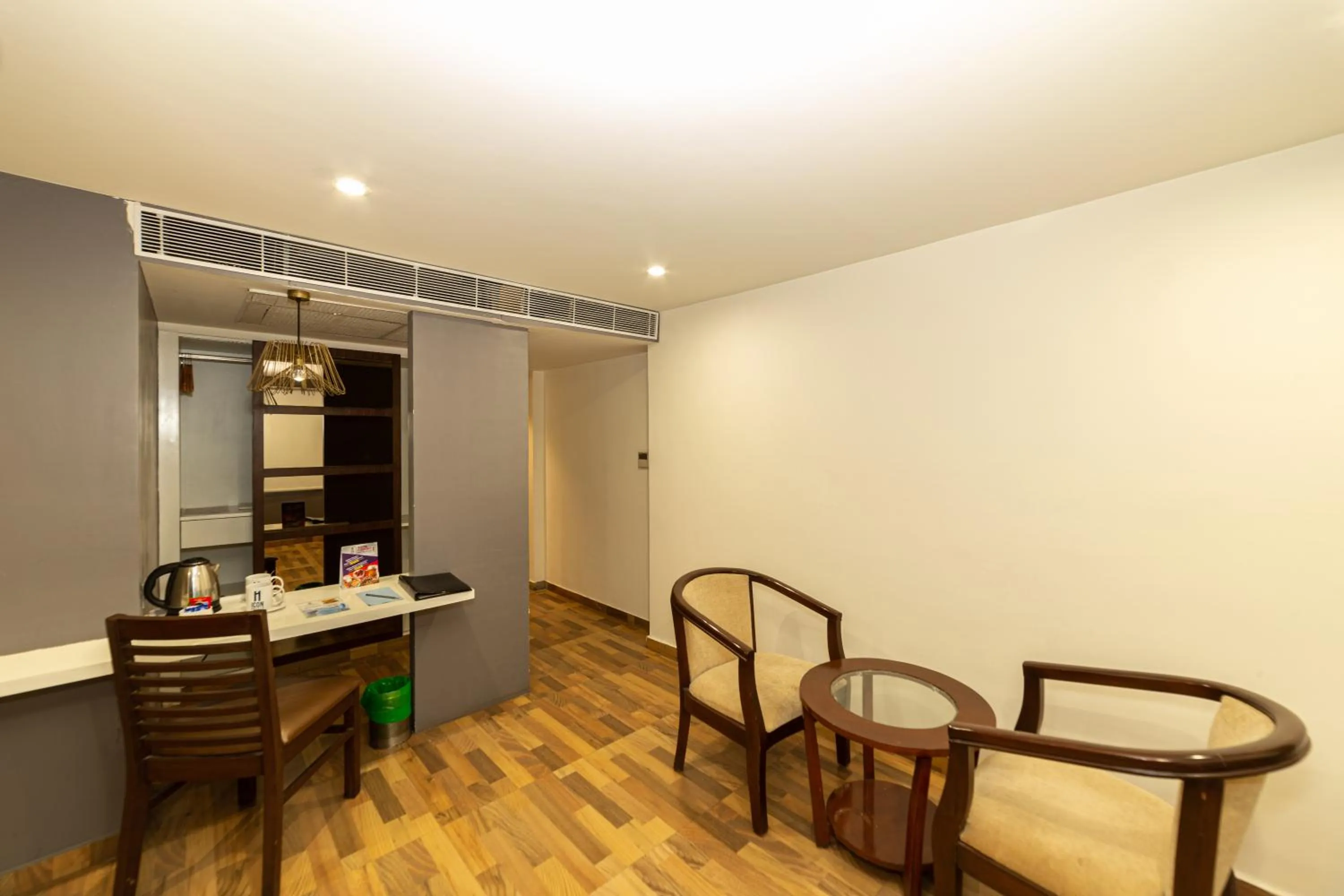 Seating area in Icon Business Hotel by Bhagini