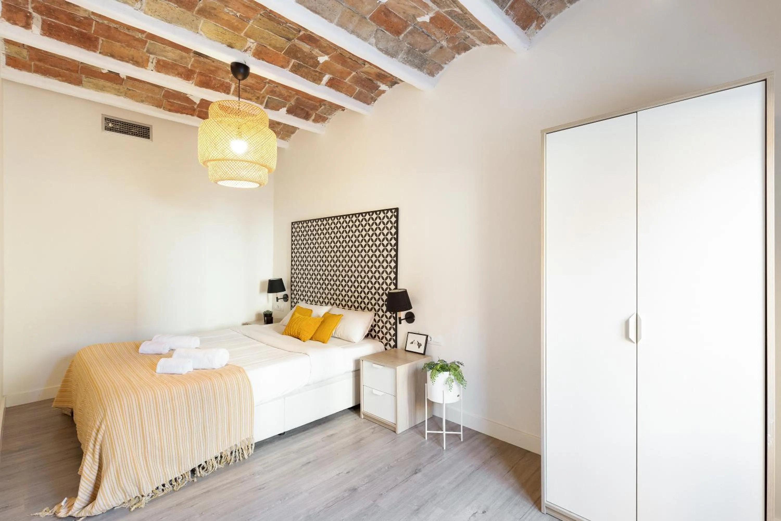 Bed in Modern Catalan Apartments by Olala Homes