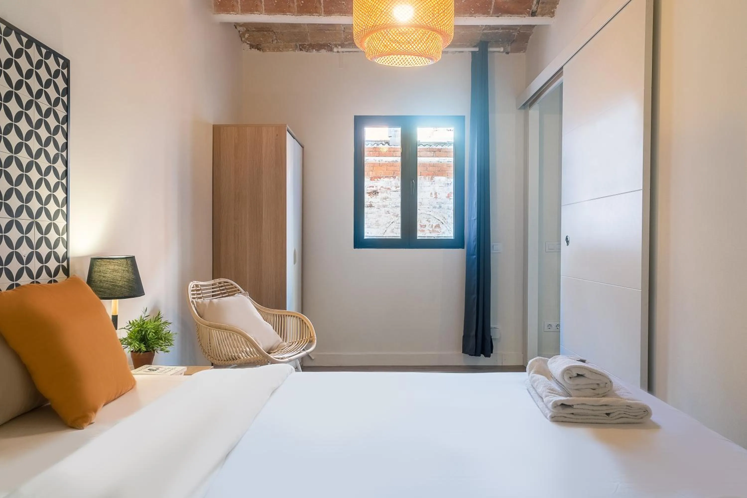 Bed in Modern Catalan Apartments by Olala Homes