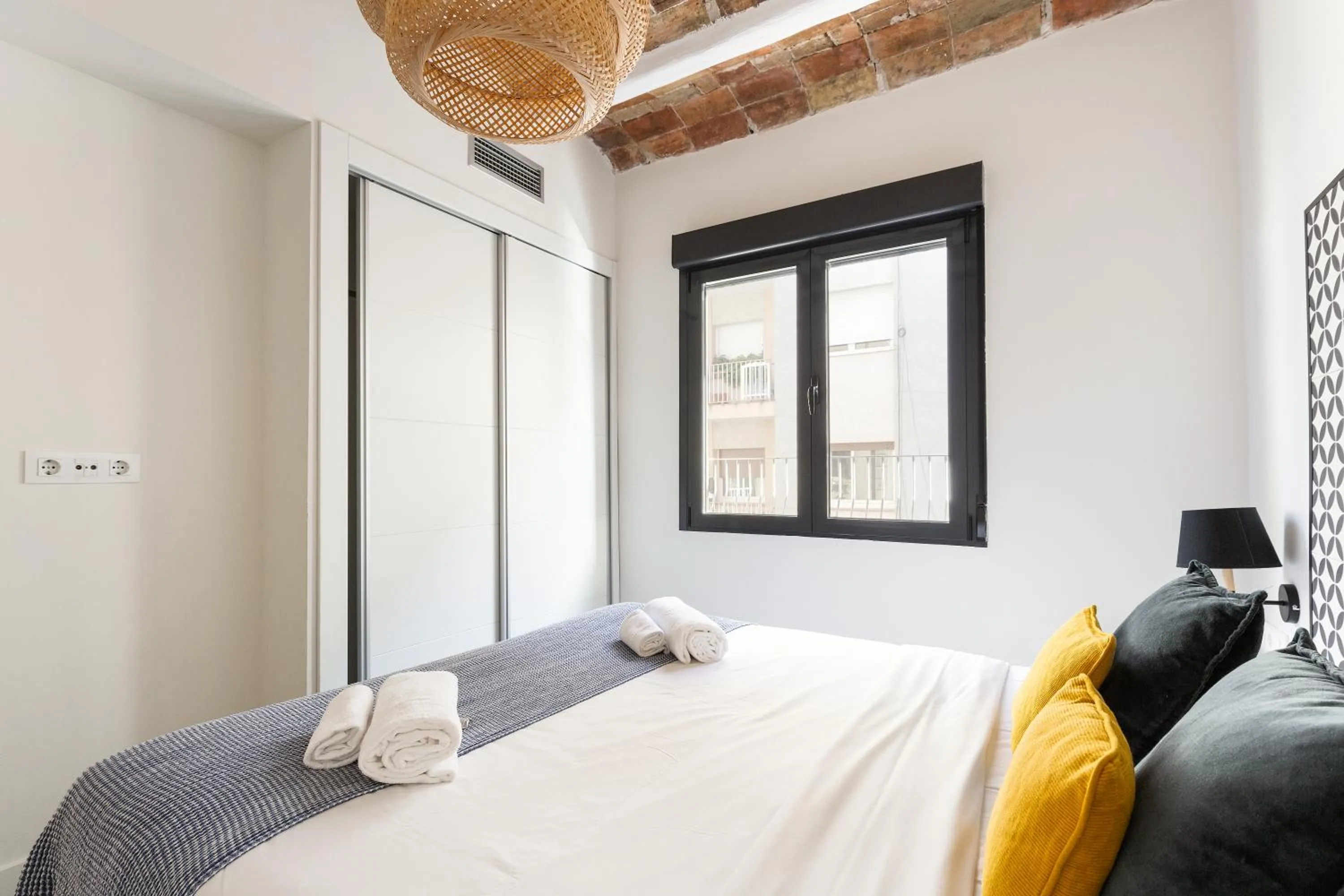 Bed in Modern Catalan Apartments by Olala Homes