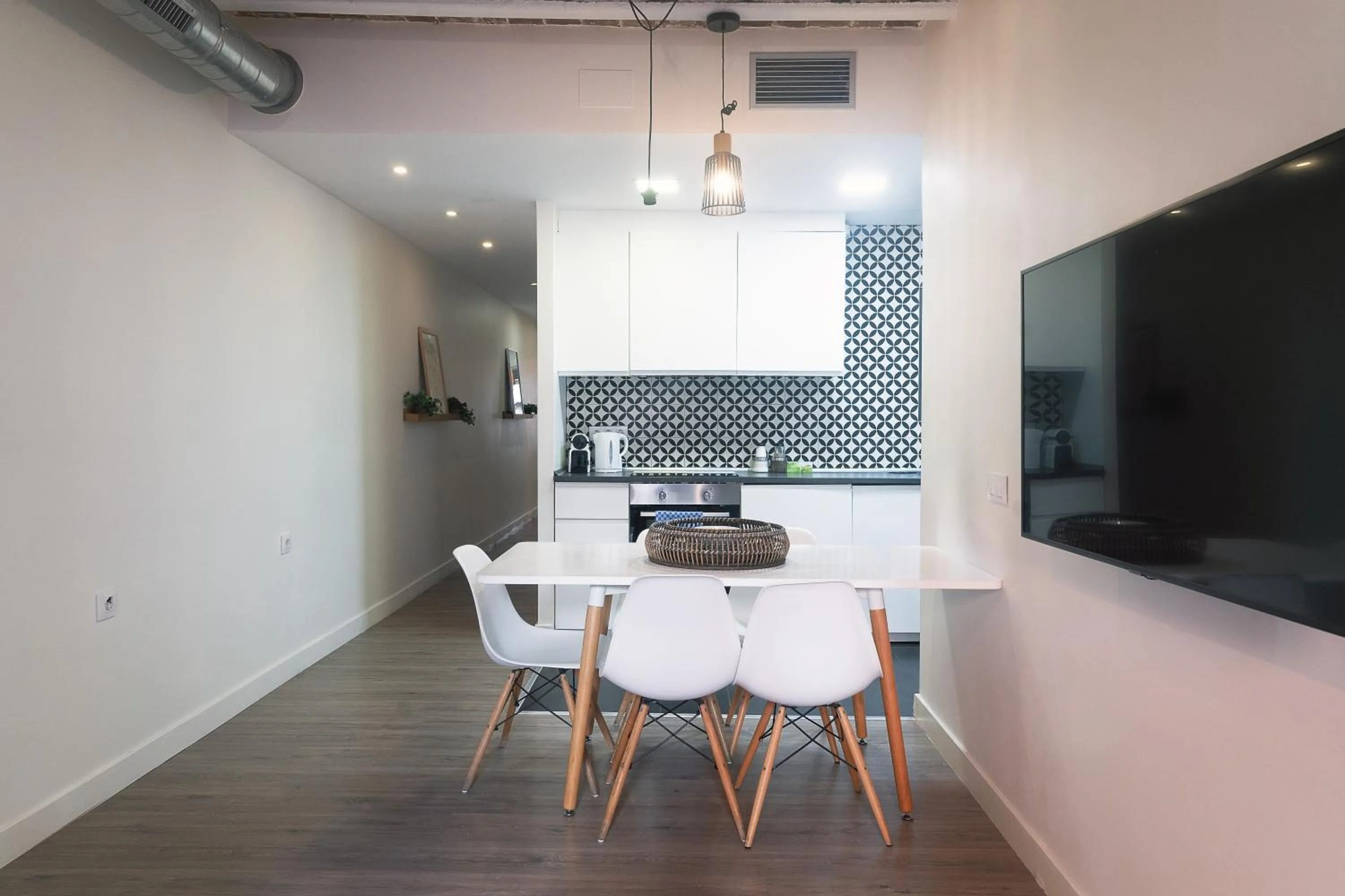 Dining area in Modern Catalan Apartments by Olala Homes