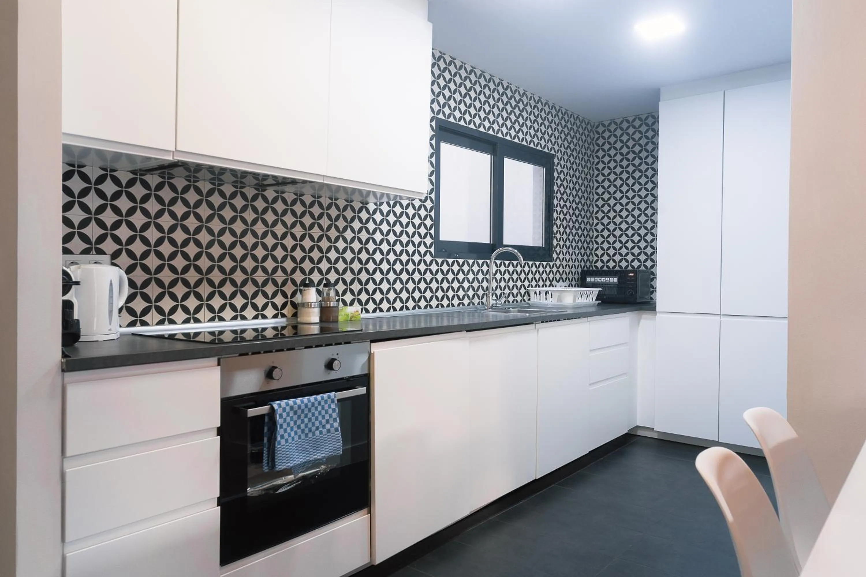 Kitchen or kitchenette in Modern Catalan Apartments by Olala Homes
