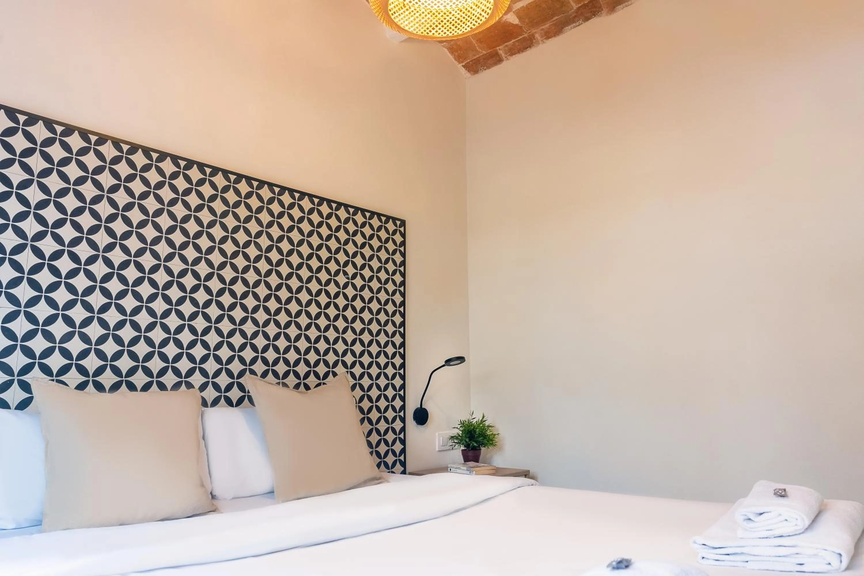 Bed in Modern Catalan Apartments by Olala Homes