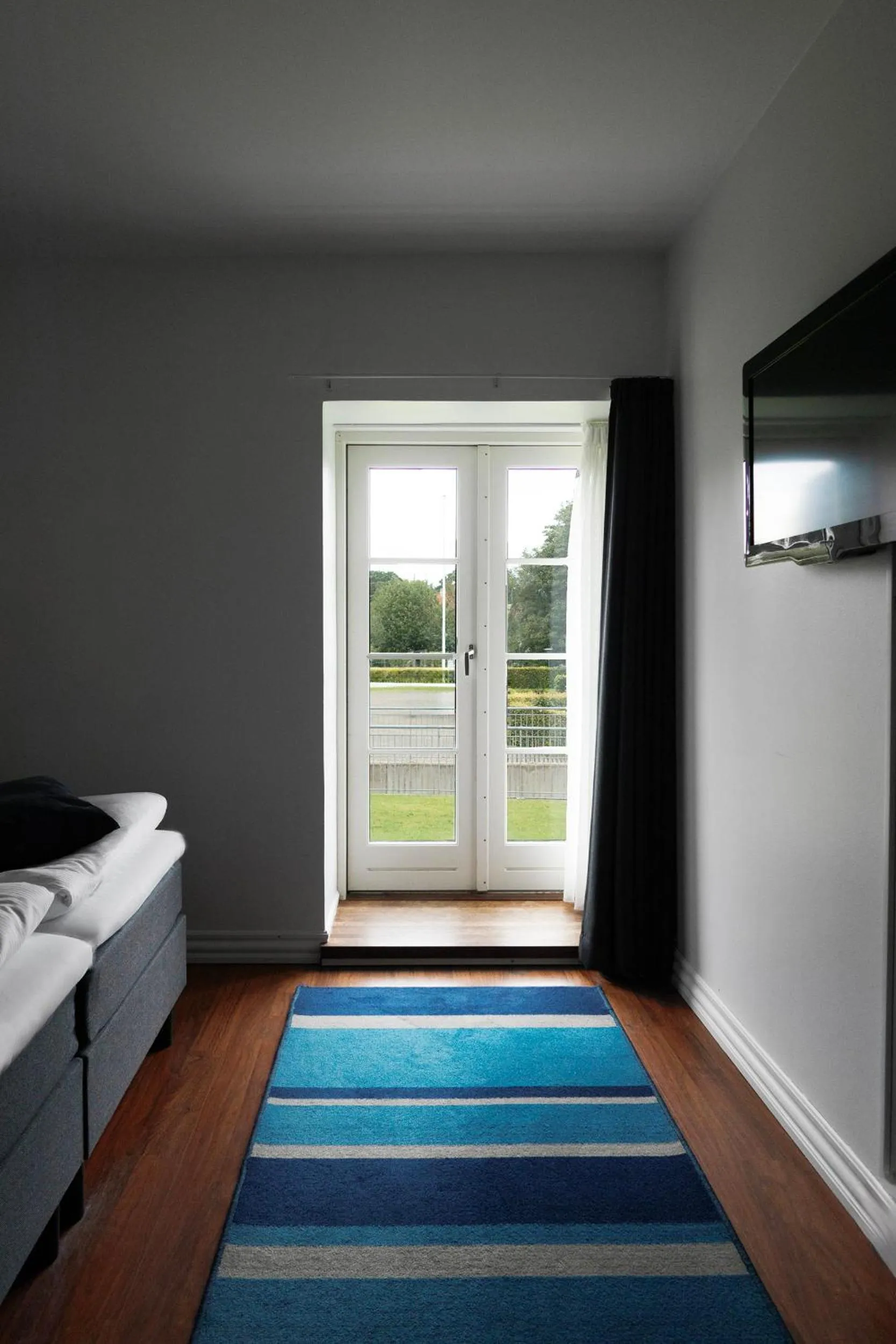 Garden view, Bed in Helnan Marselis Hotel