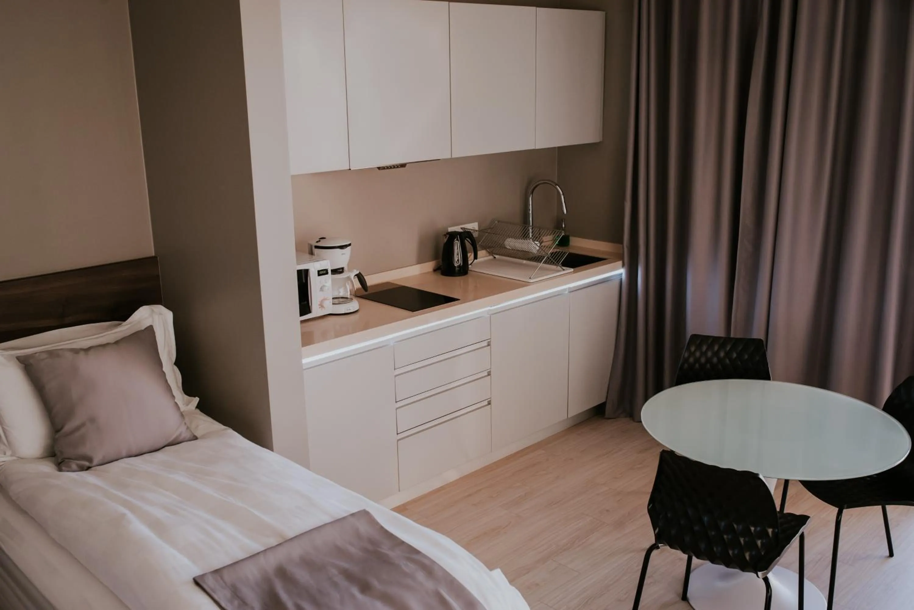 Bed in Black Beach Suites