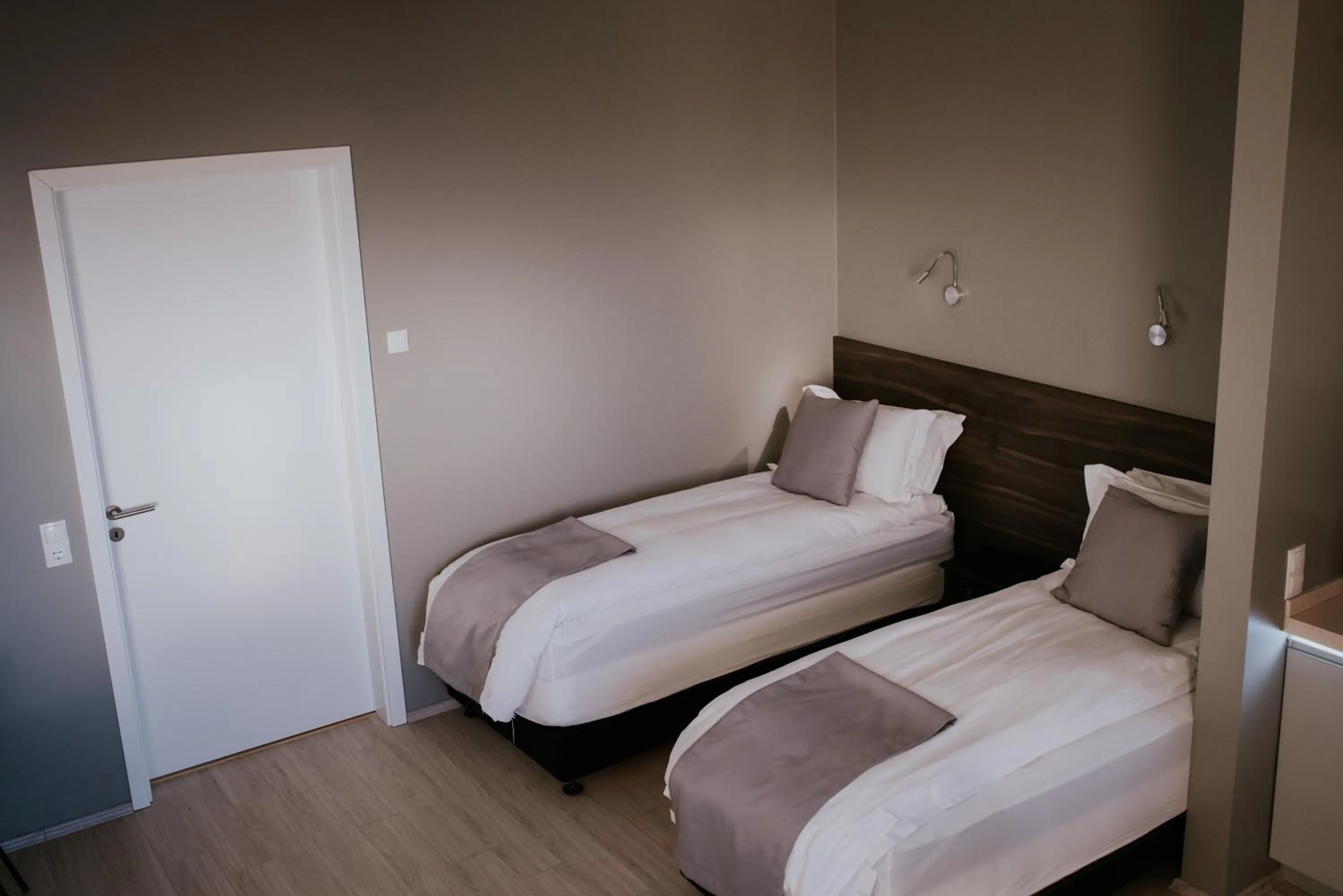 Bed in Black Beach Suites