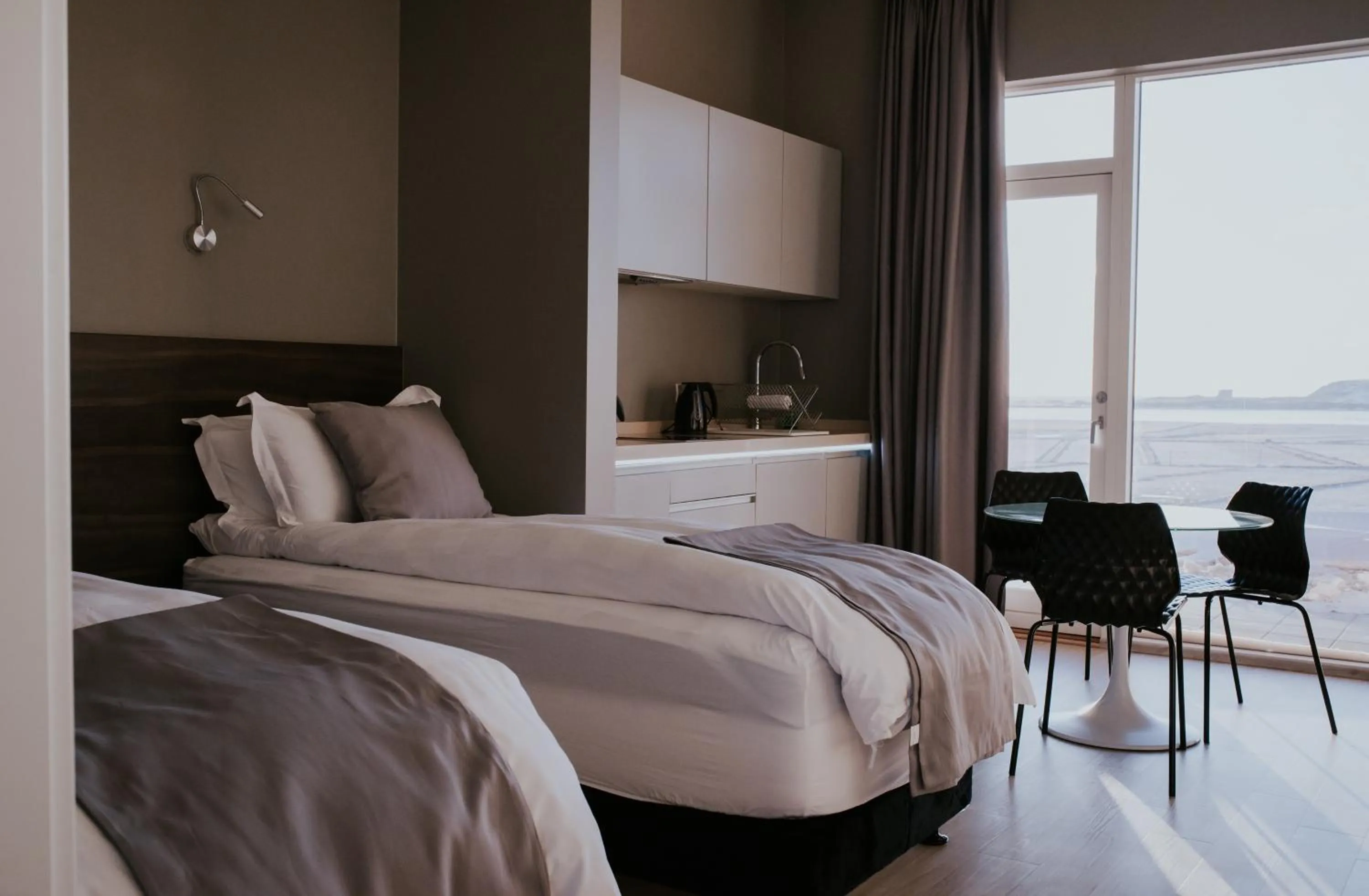 Bed in Black Beach Suites