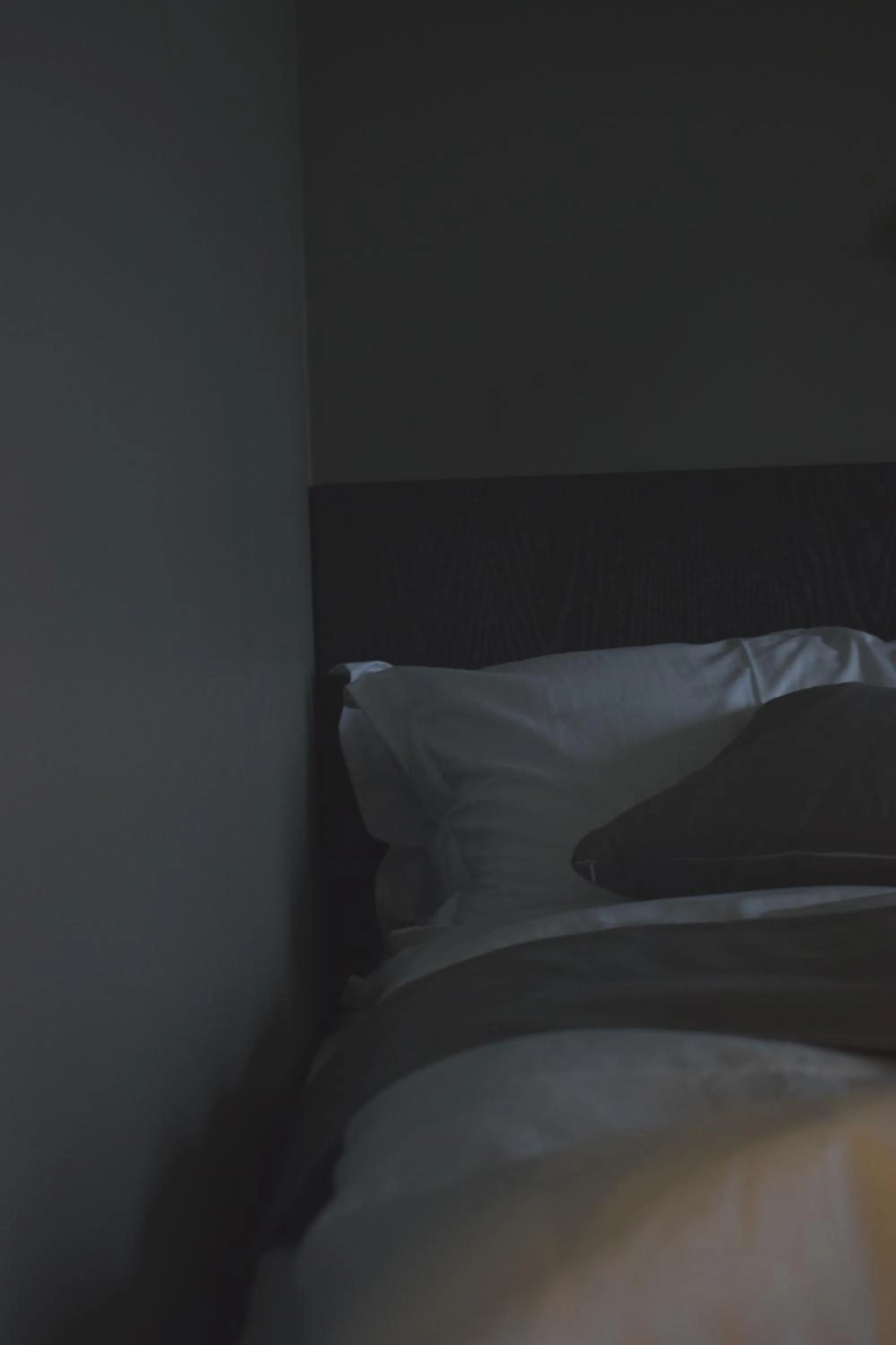 Bed in Black Beach Suites