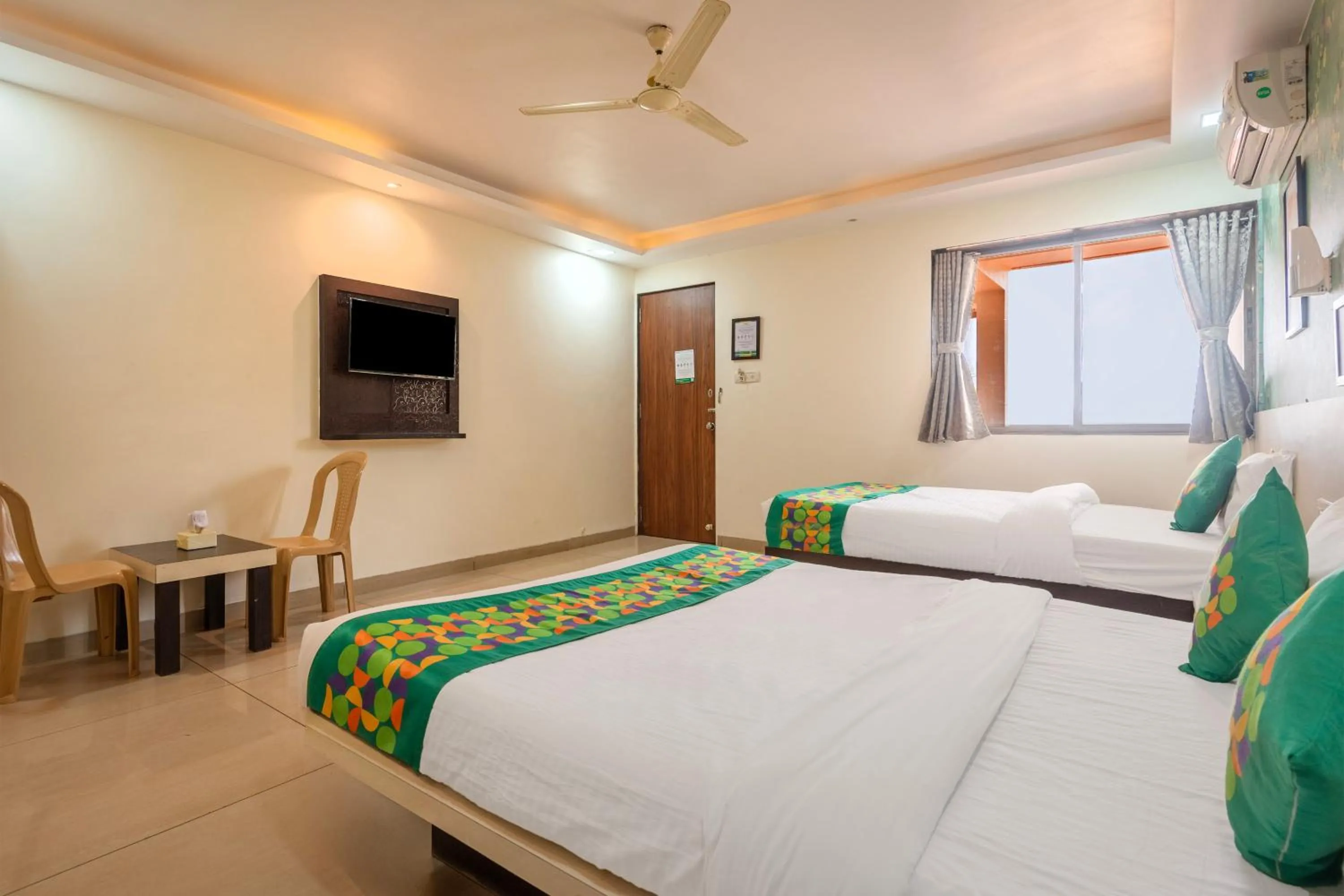 Bedroom, Bed in Treebo Kuber Palace with Swimming Pool