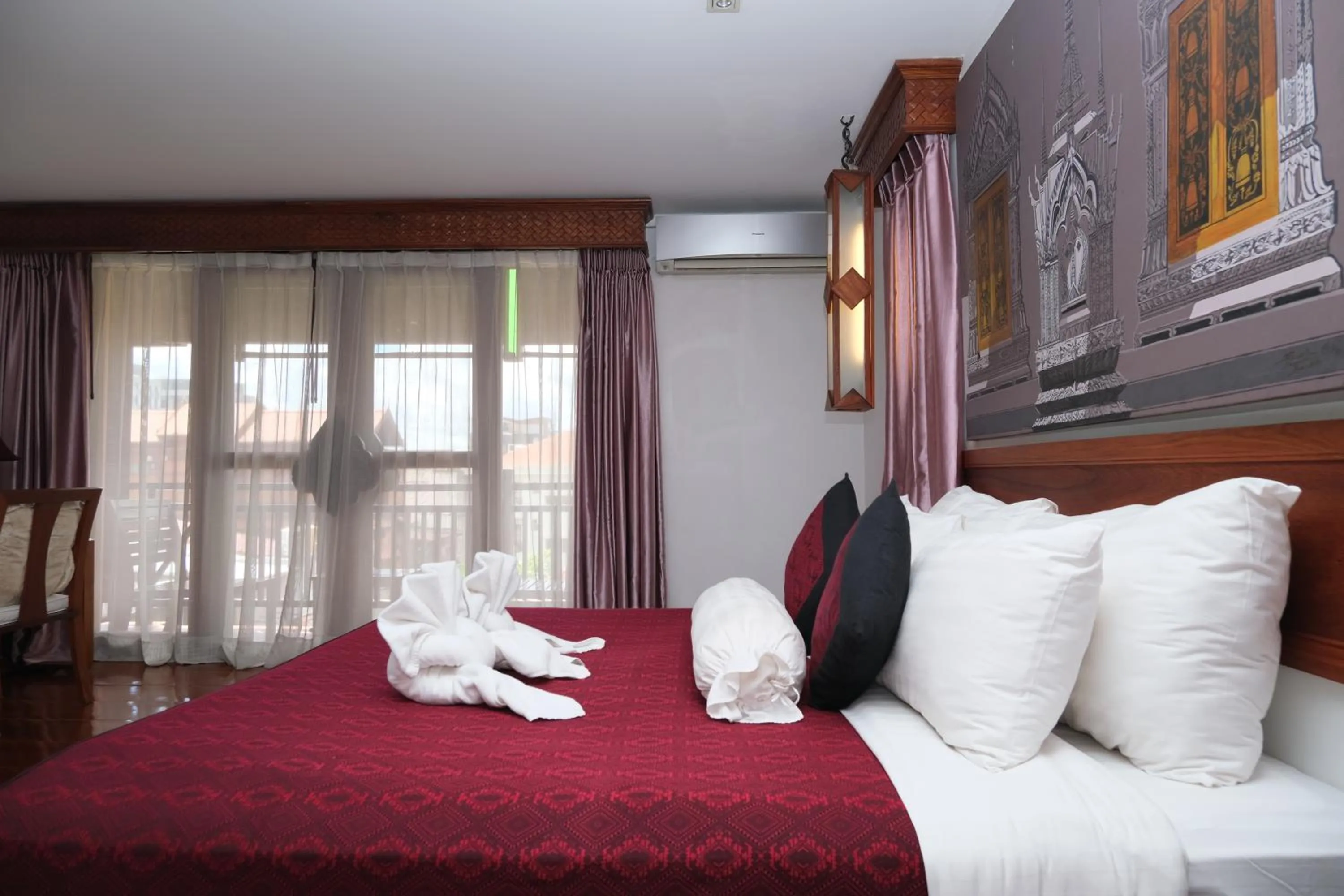 Bed in Chanthapanya Hotel