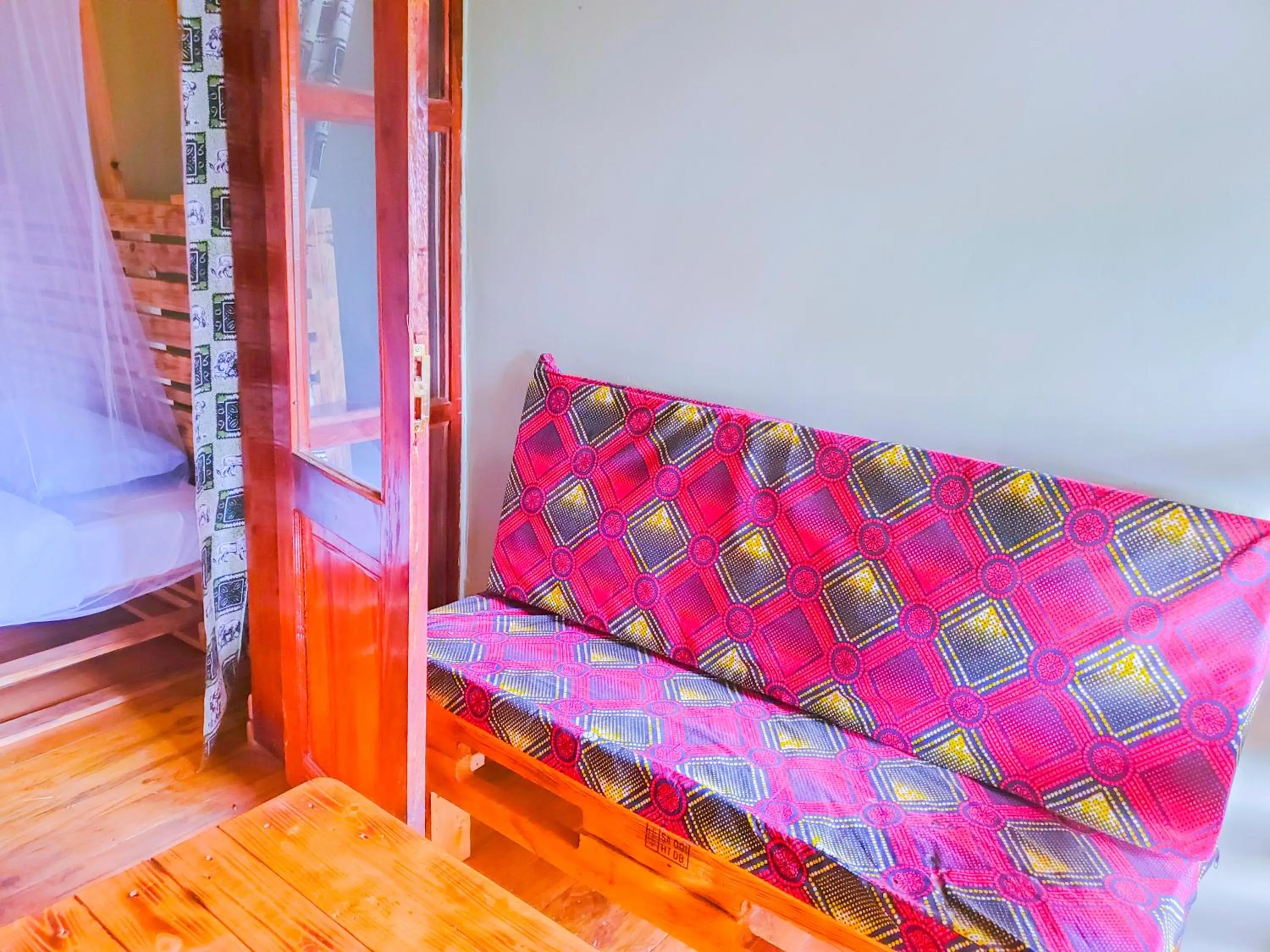 Seating area, Bed in Elite Backpackers Services