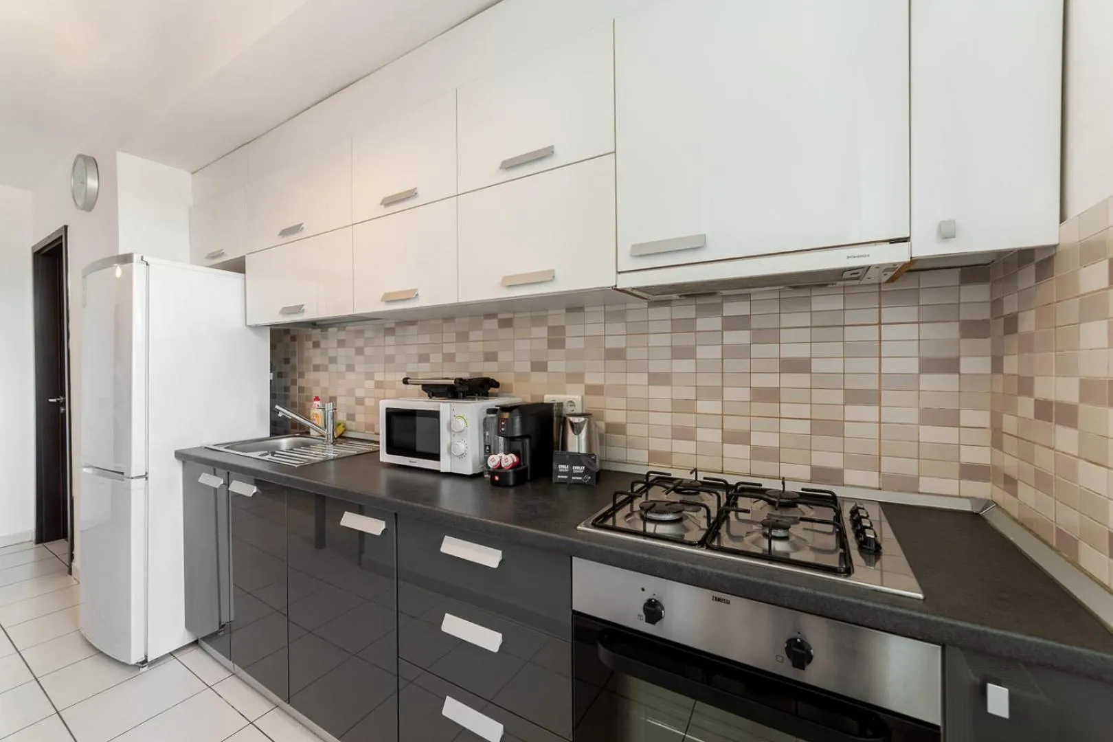 Kitchen or kitchenette in Monaco Grand Apartments By CityBookings