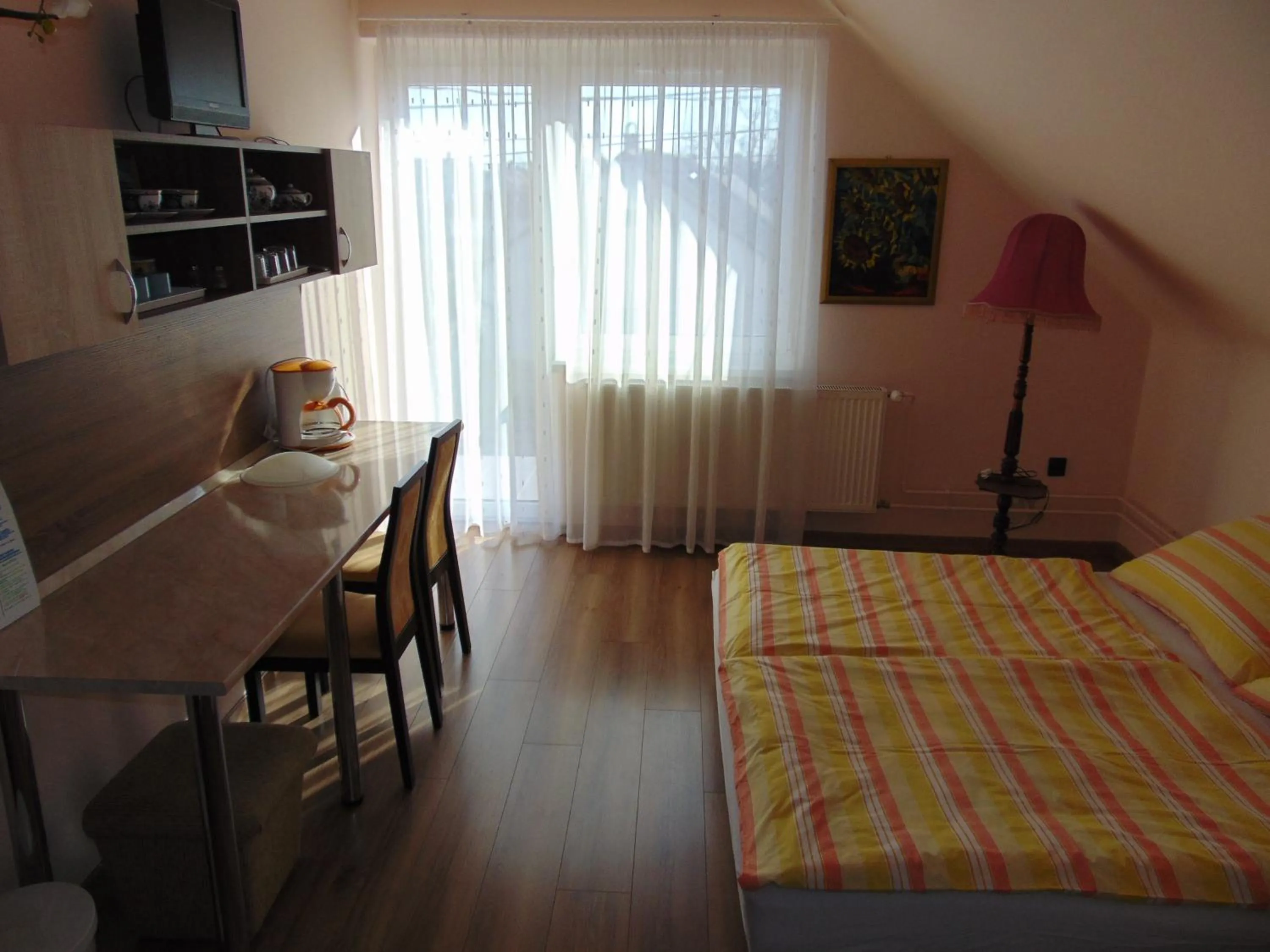 Bed in Anna Báthory Apartmanház