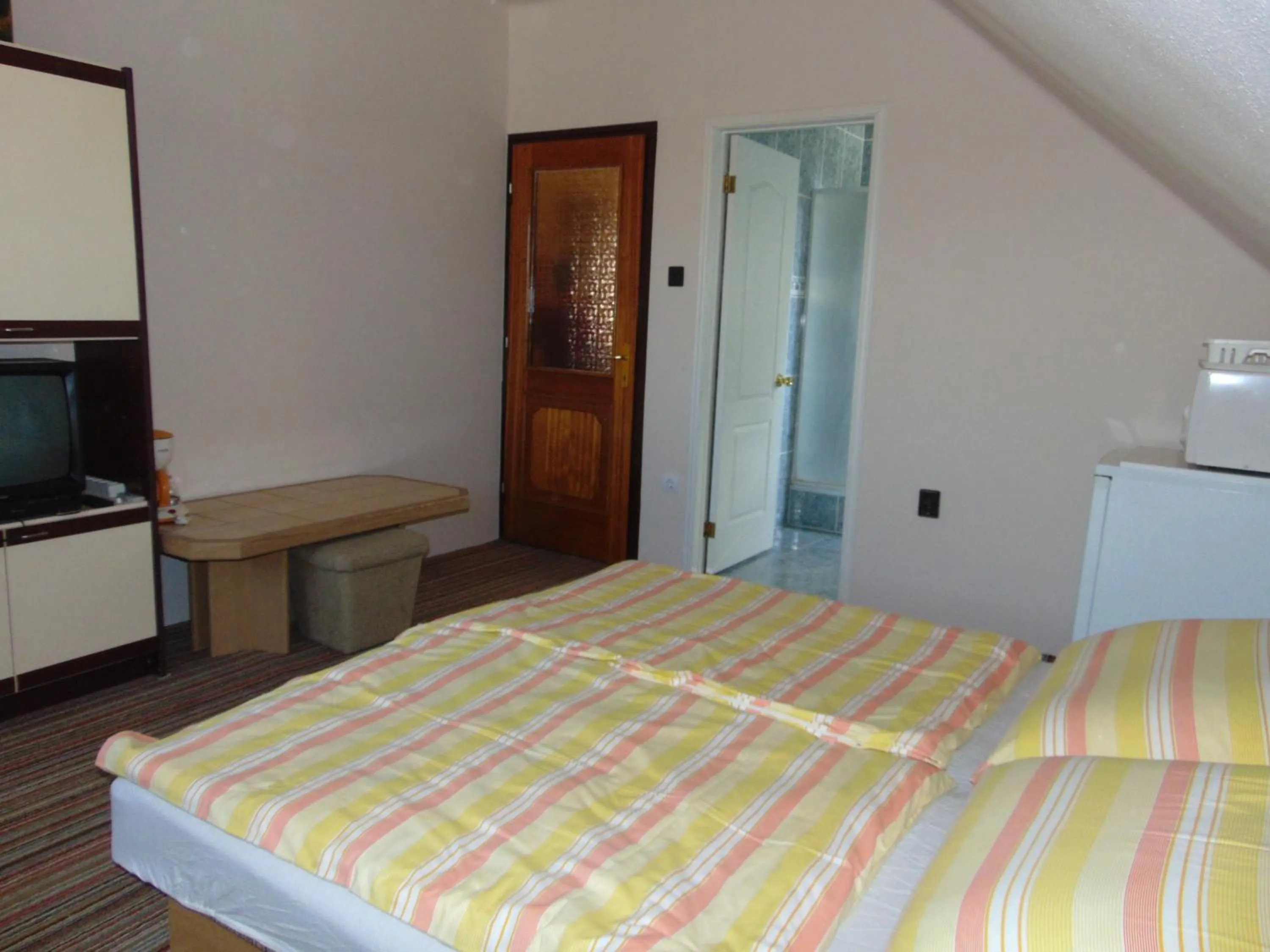 Bed in Anna Báthory Apartmanház