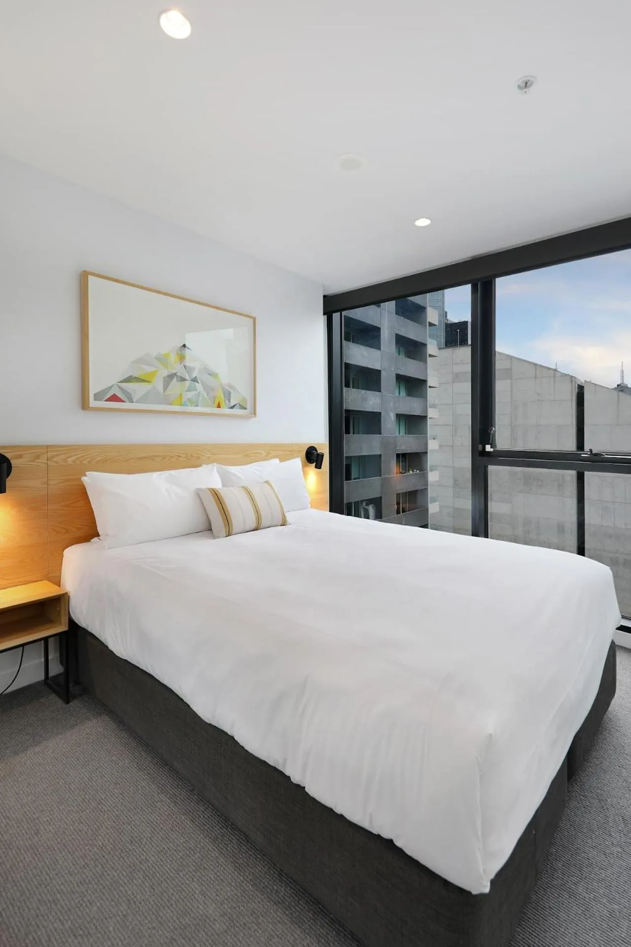 Bed in The Canvas Apartment Hotel