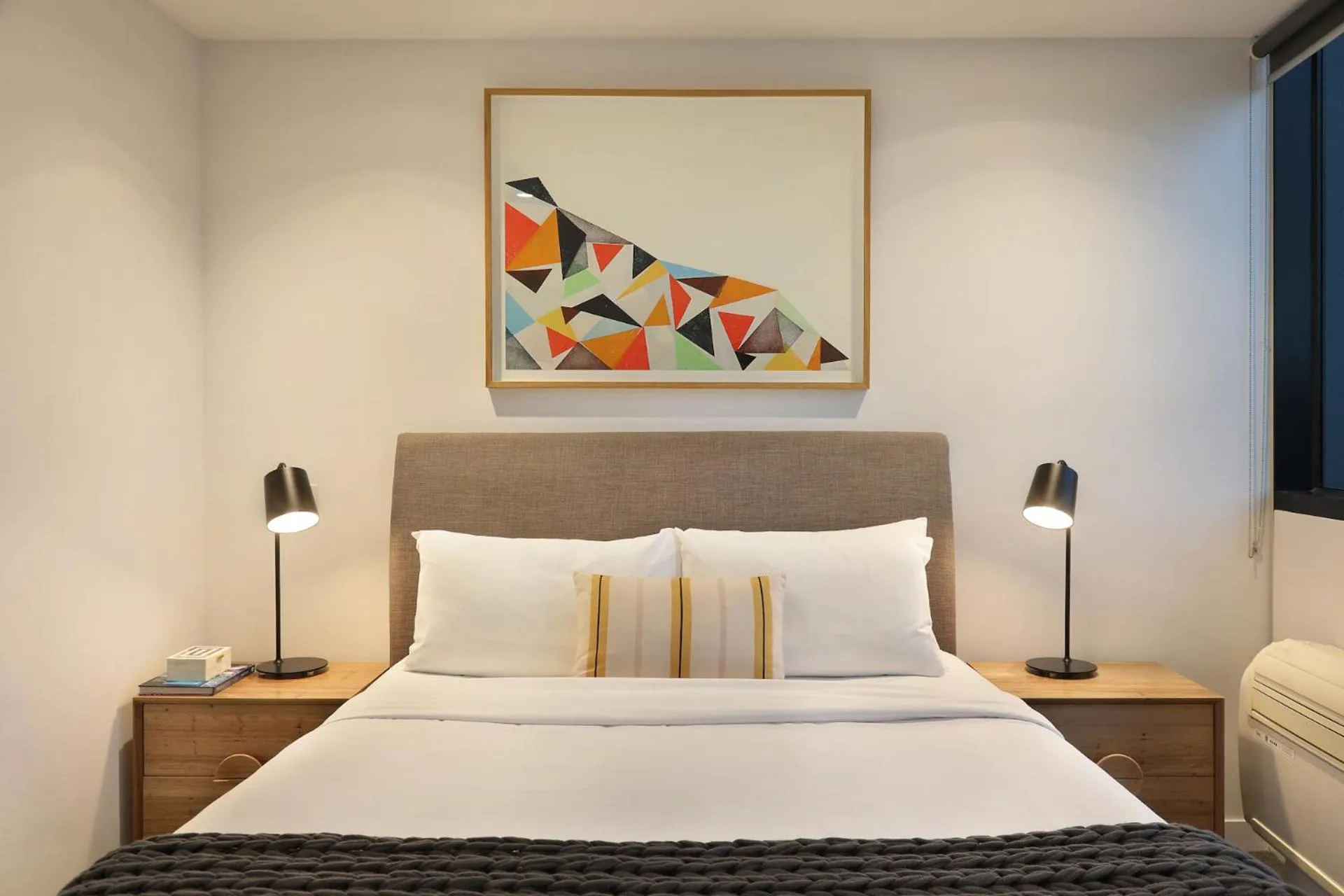 Bed in The Canvas Apartment Hotel