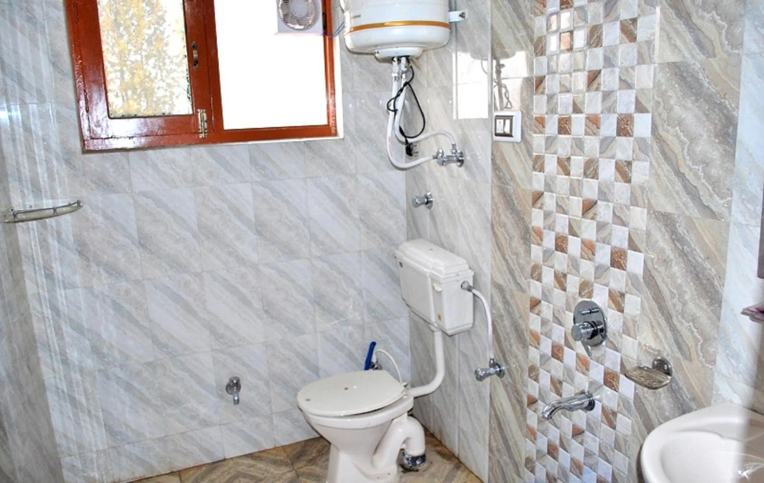 Bathroom in FabHotel Grand Comforts - Near Airport