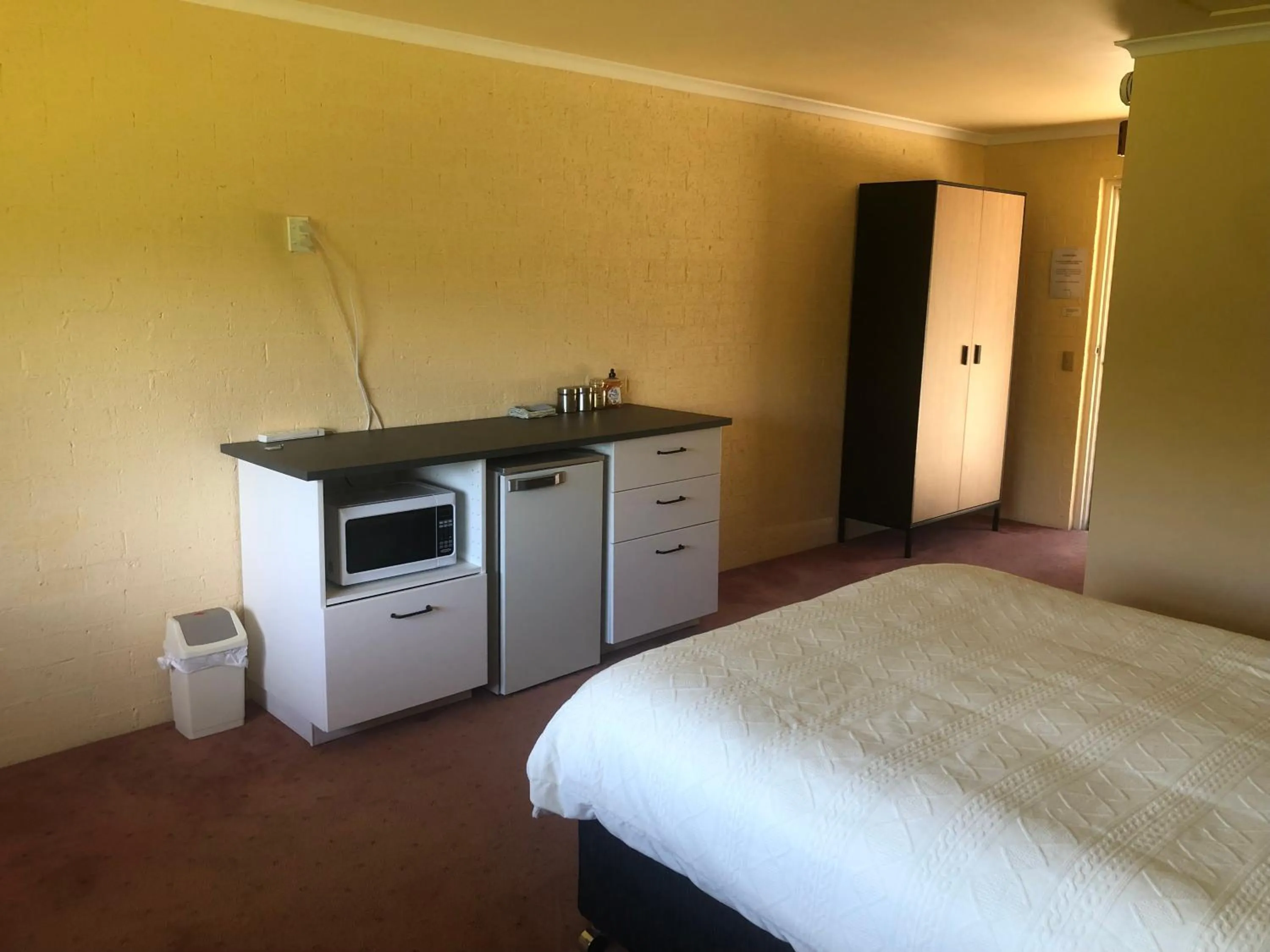 Bed in Colonial Inn Guest Rooms