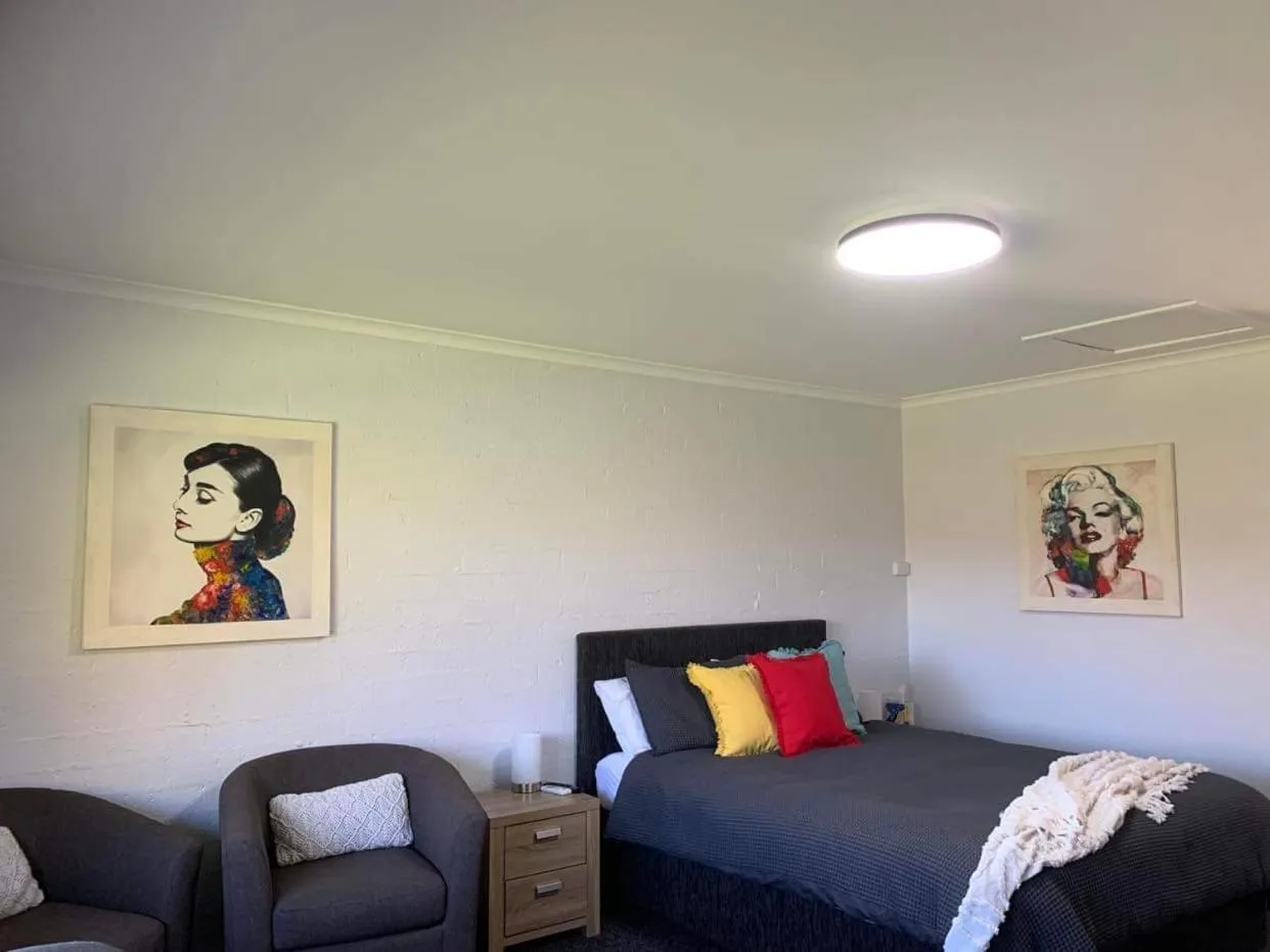 Bed in Colonial Inn Guest Rooms