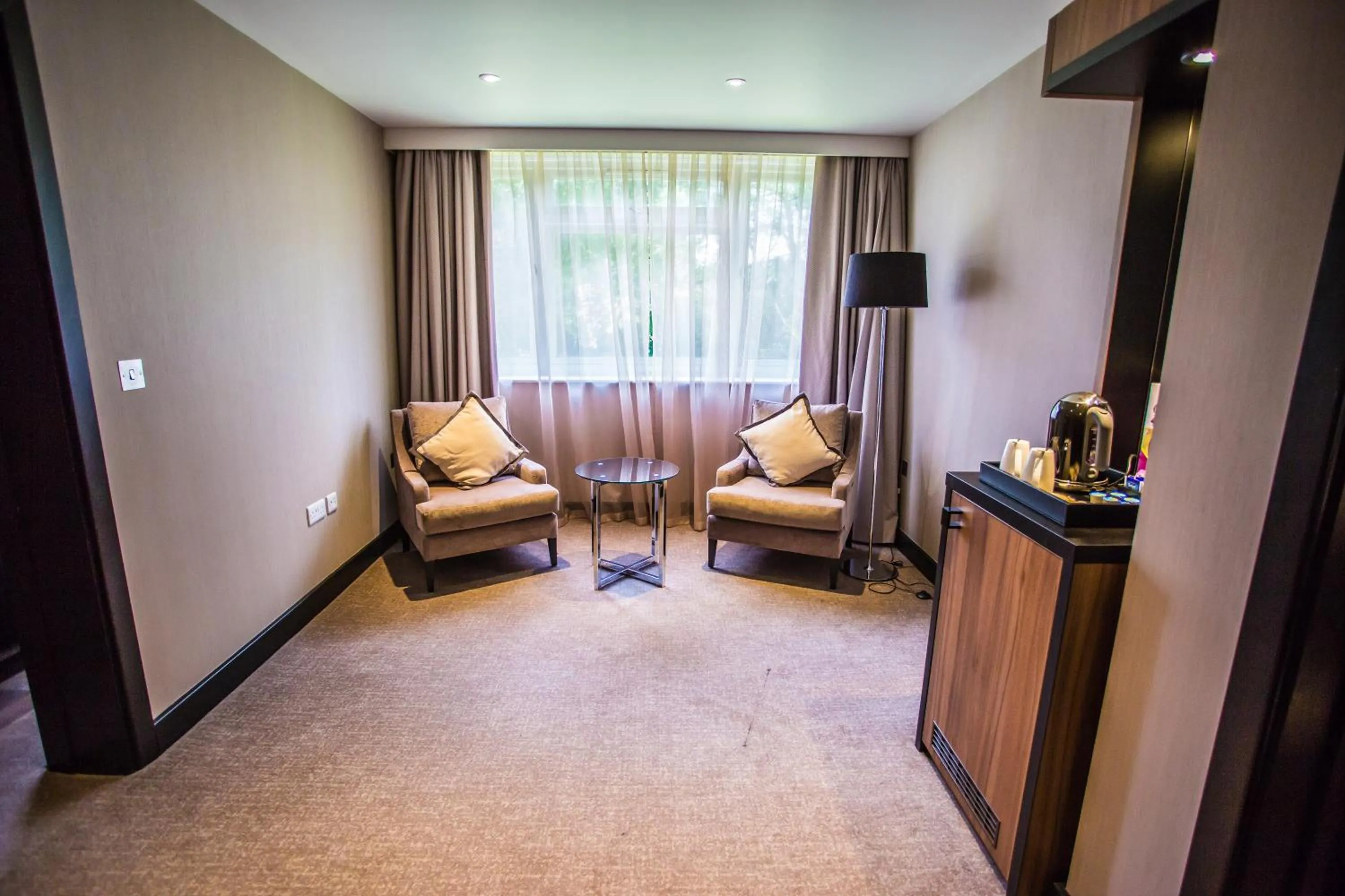 Living room in Crowne Plaza Gerrards Cross by IHG
