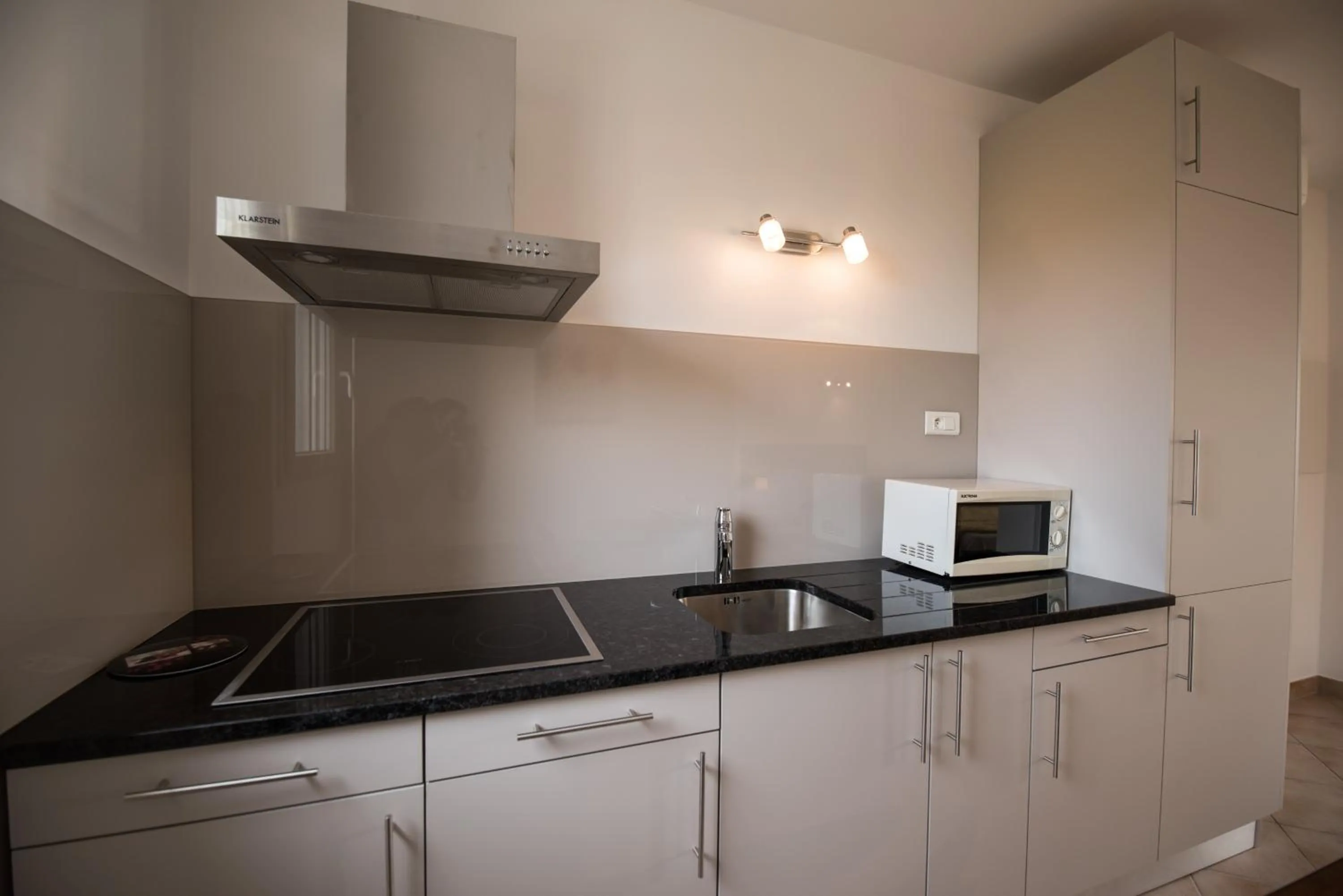 Kitchen or kitchenette in Les Alizés Résidence & Spa