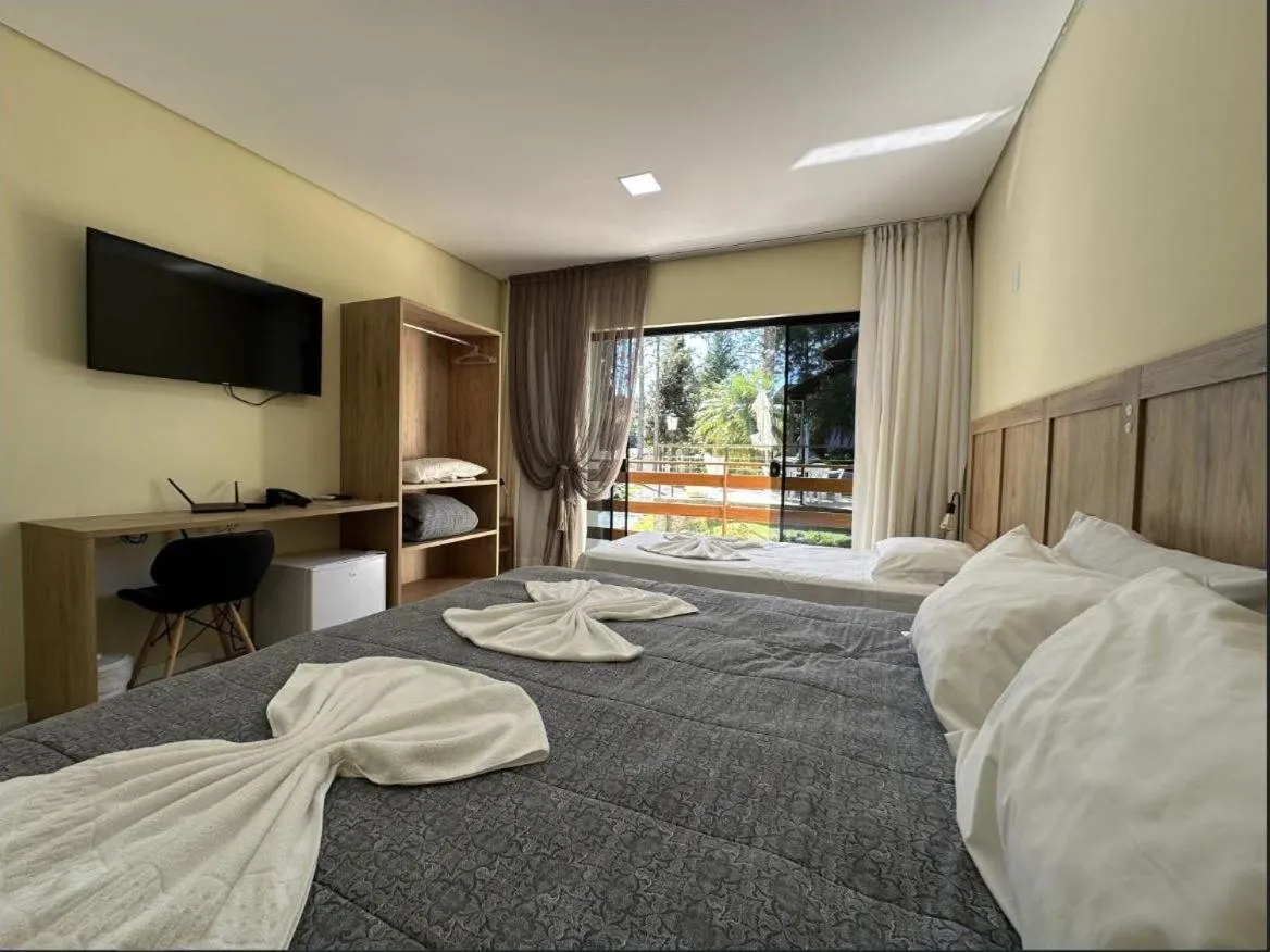 Bed in Pousada Casarão Gastehaus