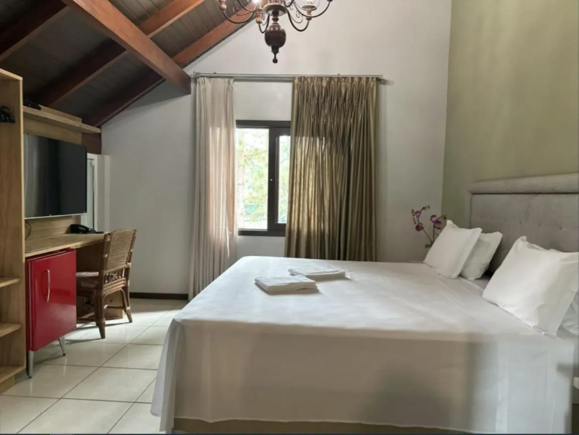 Bed in Pousada Casarão Gastehaus