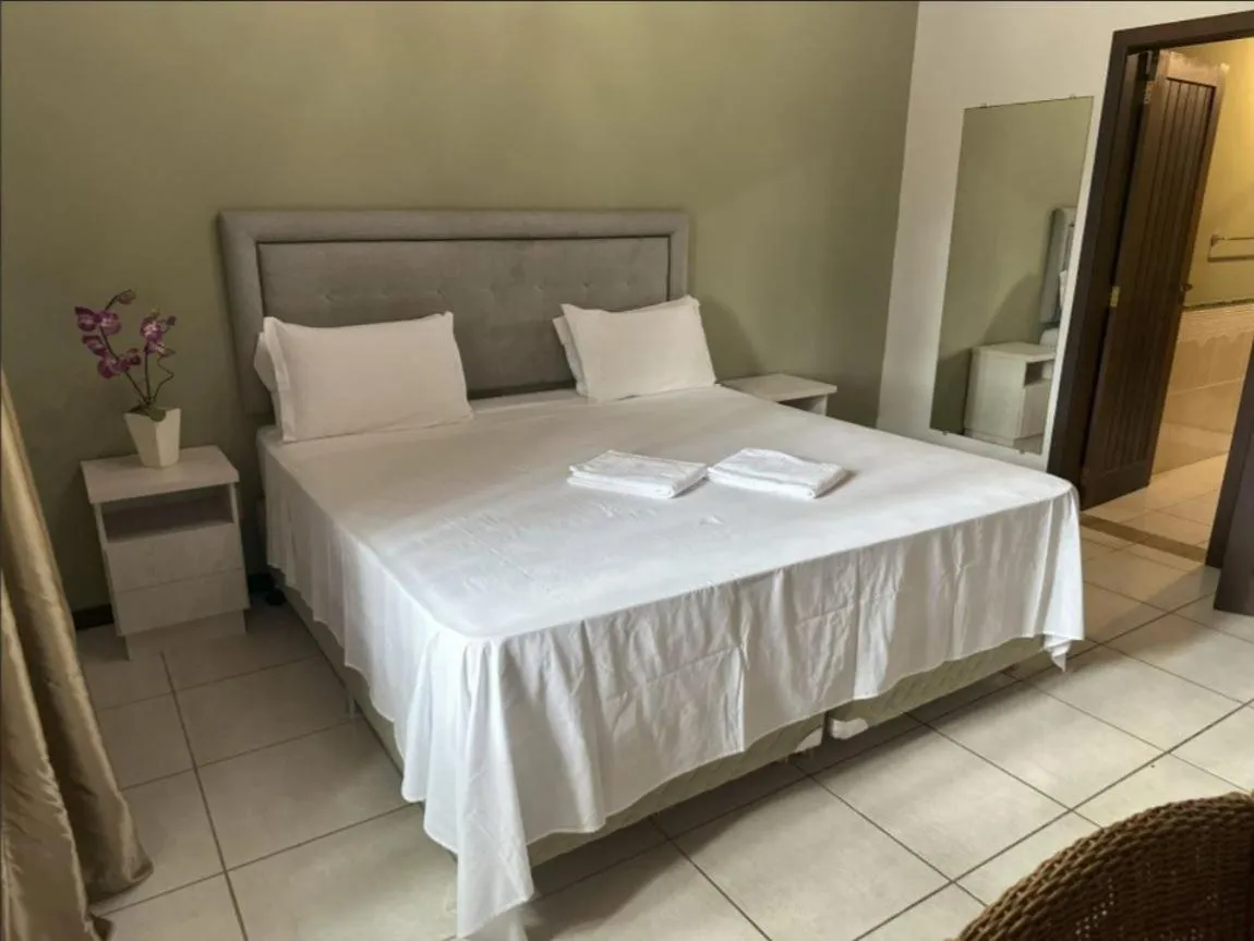 Bed in Pousada Casarão Gastehaus