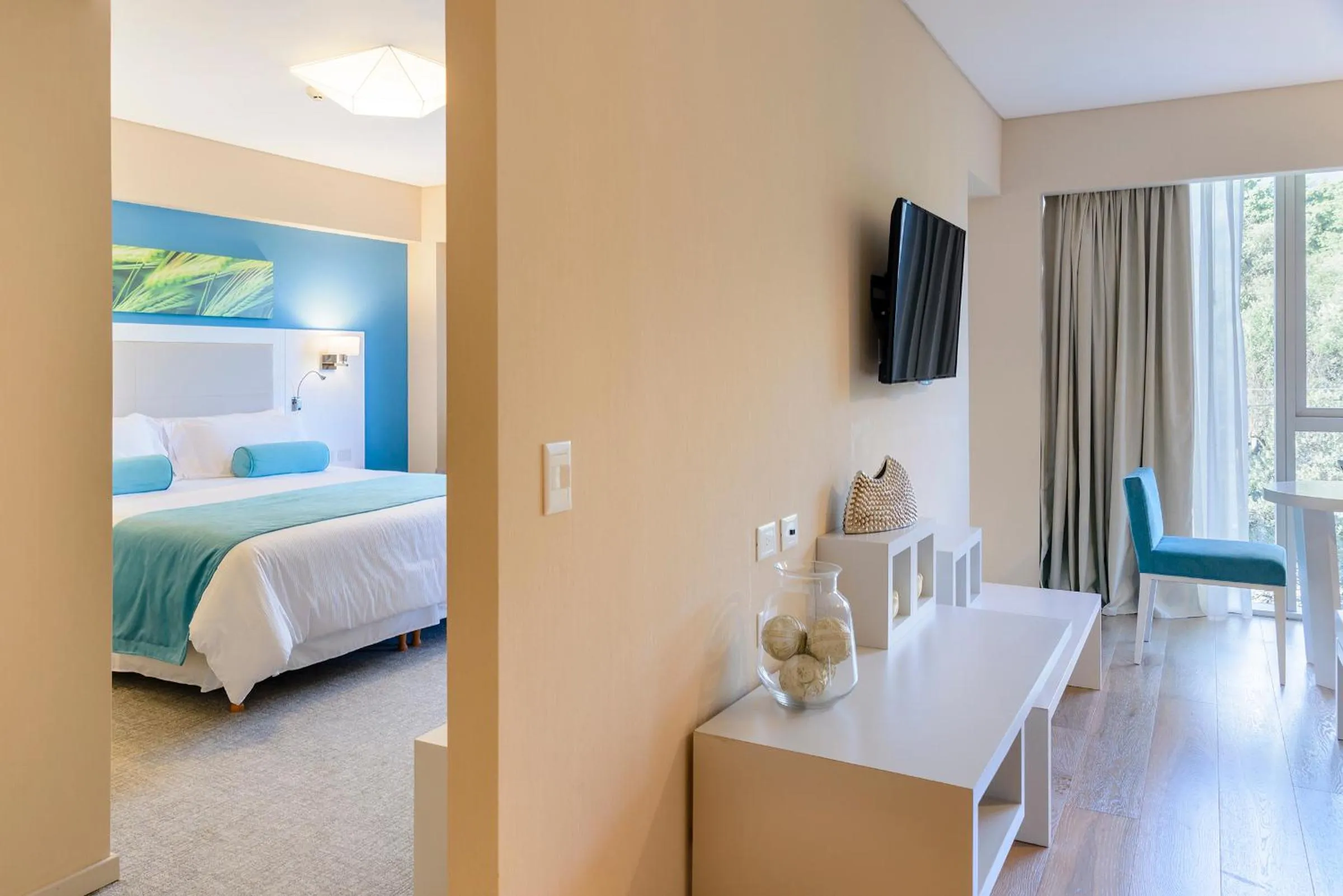 Living room, Bed in Epic Hotel Villa de Merlo