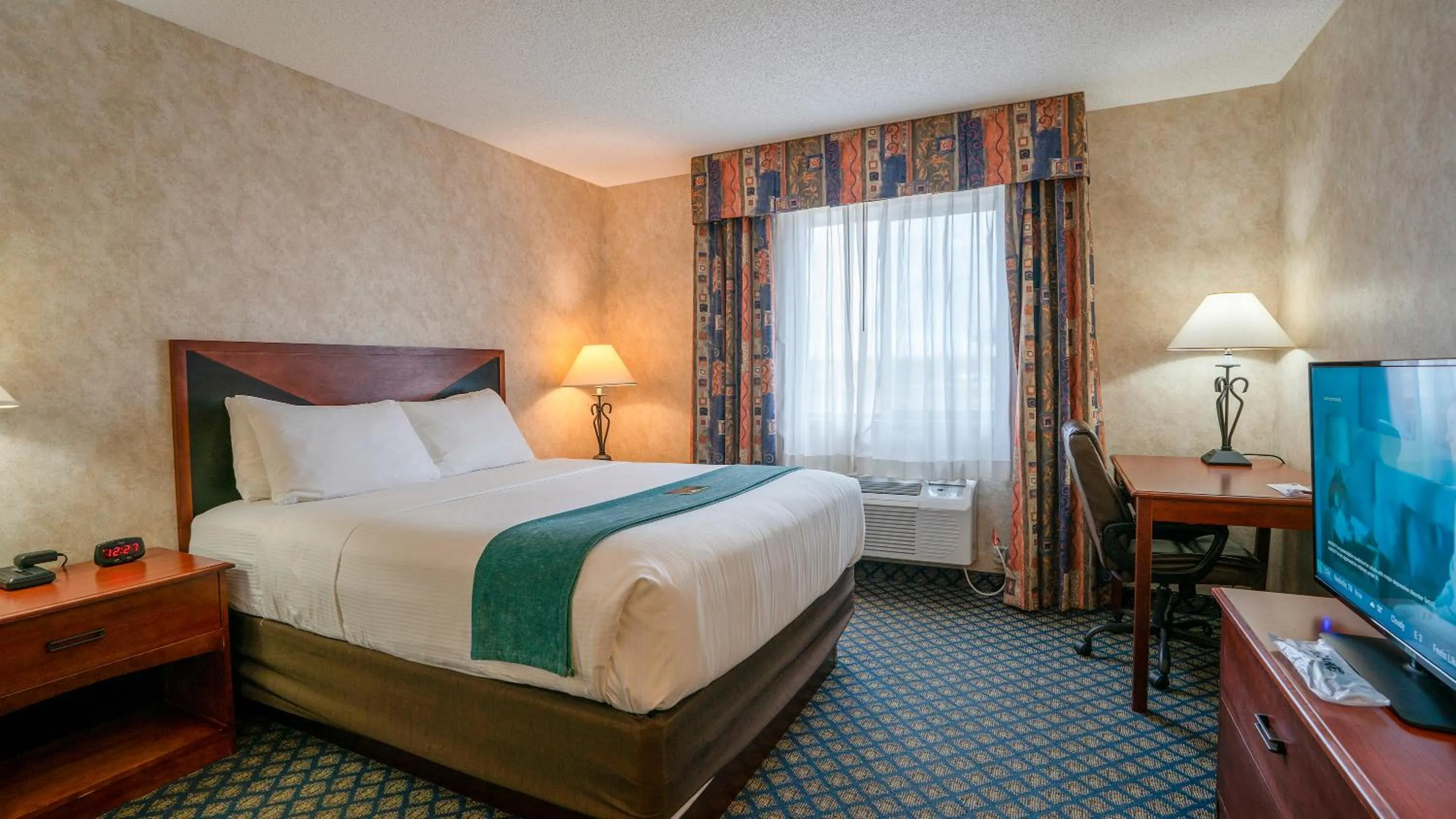 Bed in Miles City Hotel & Suites