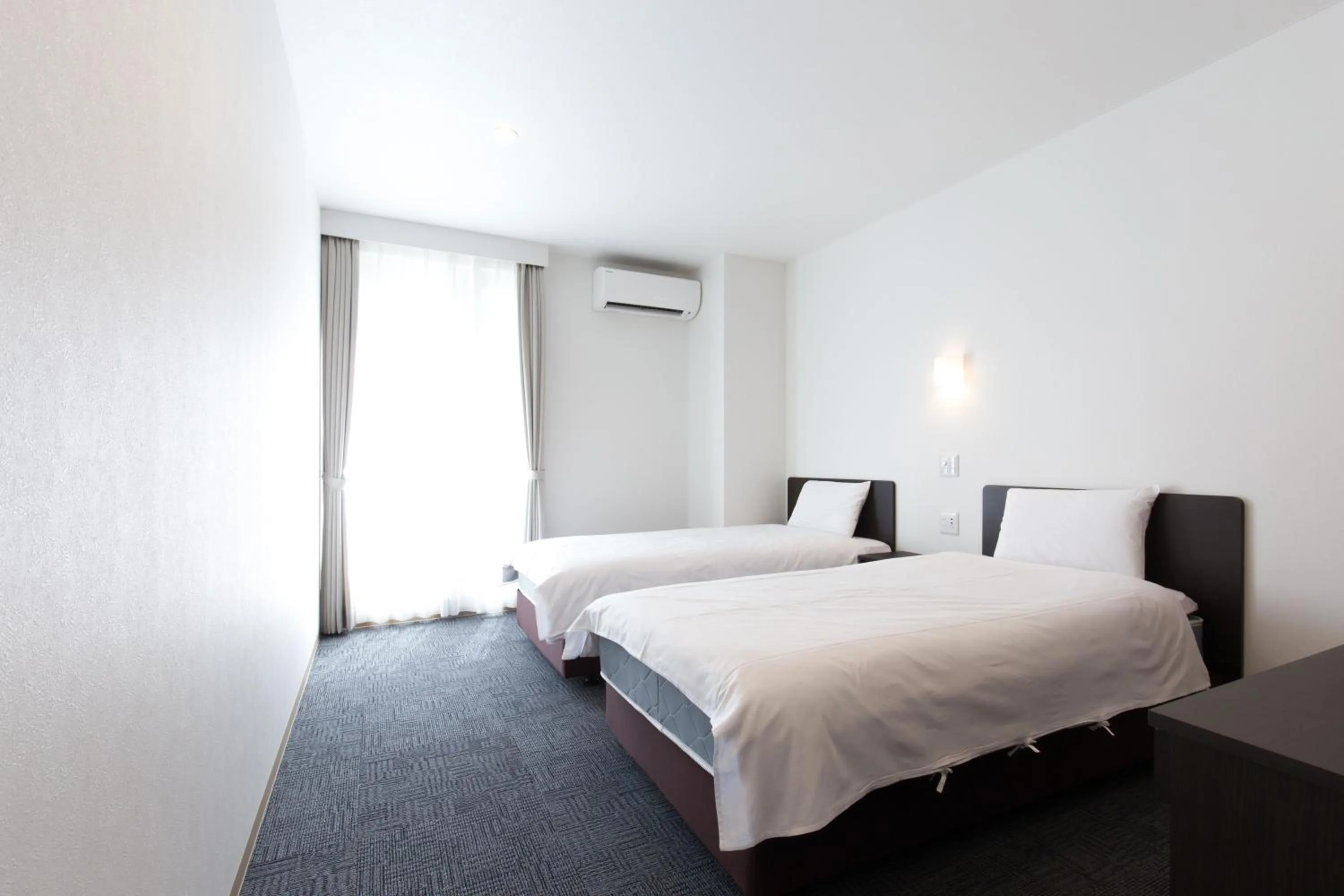 Bed in Toyokawa Grand Hotel