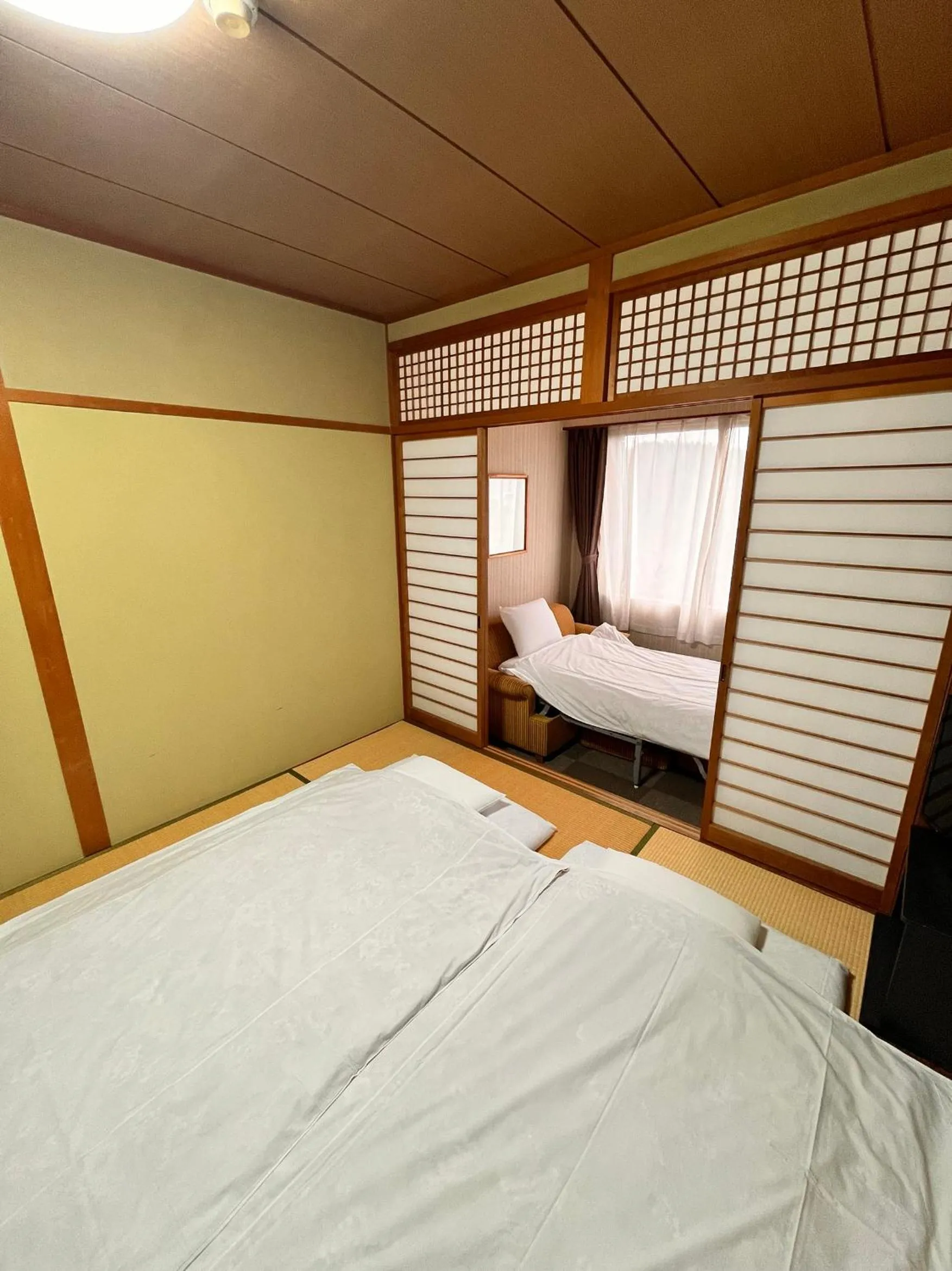 Bed in Toyokawa Grand Hotel