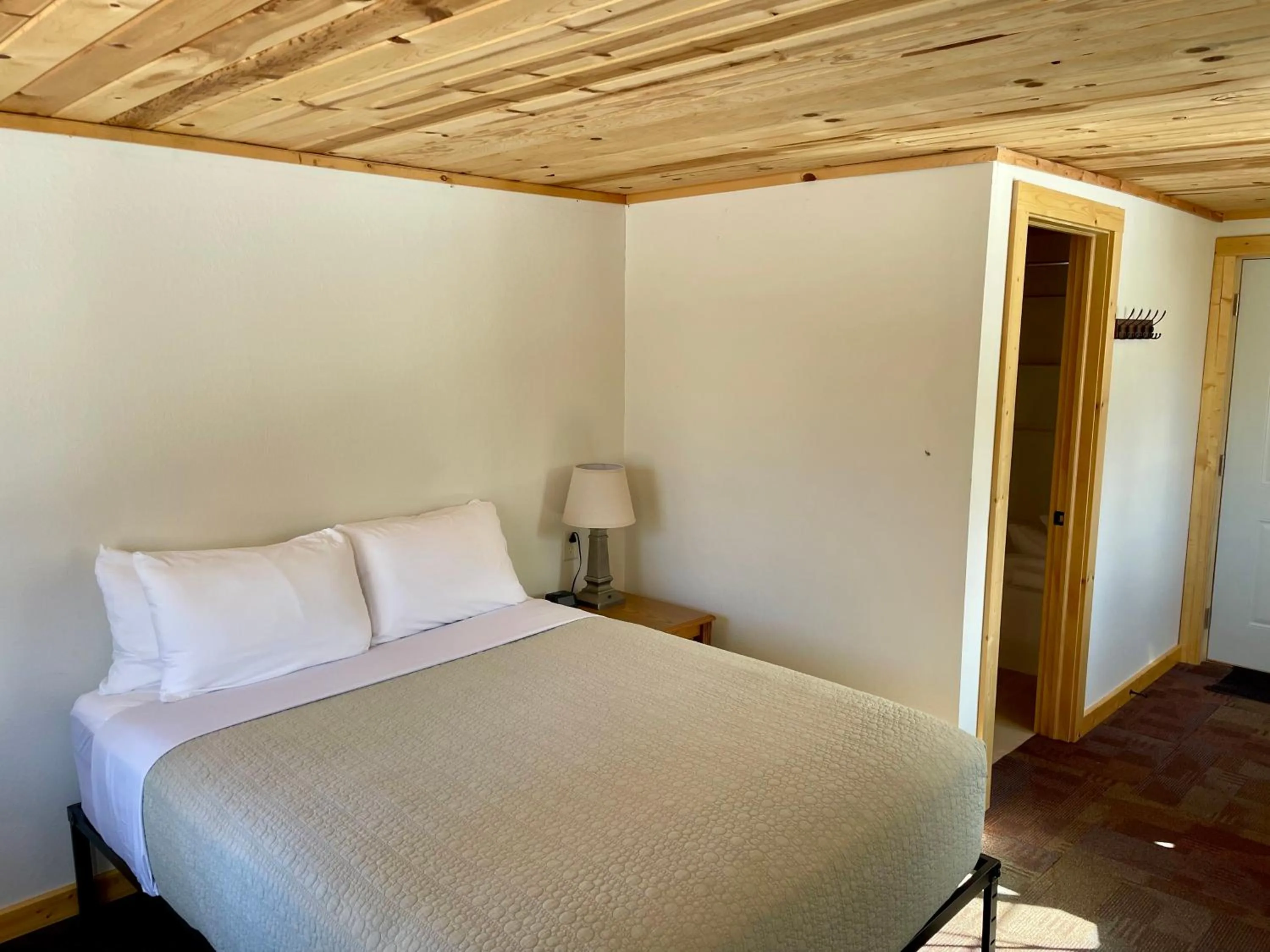 Bed in Hanging Horn Lakeside Resort